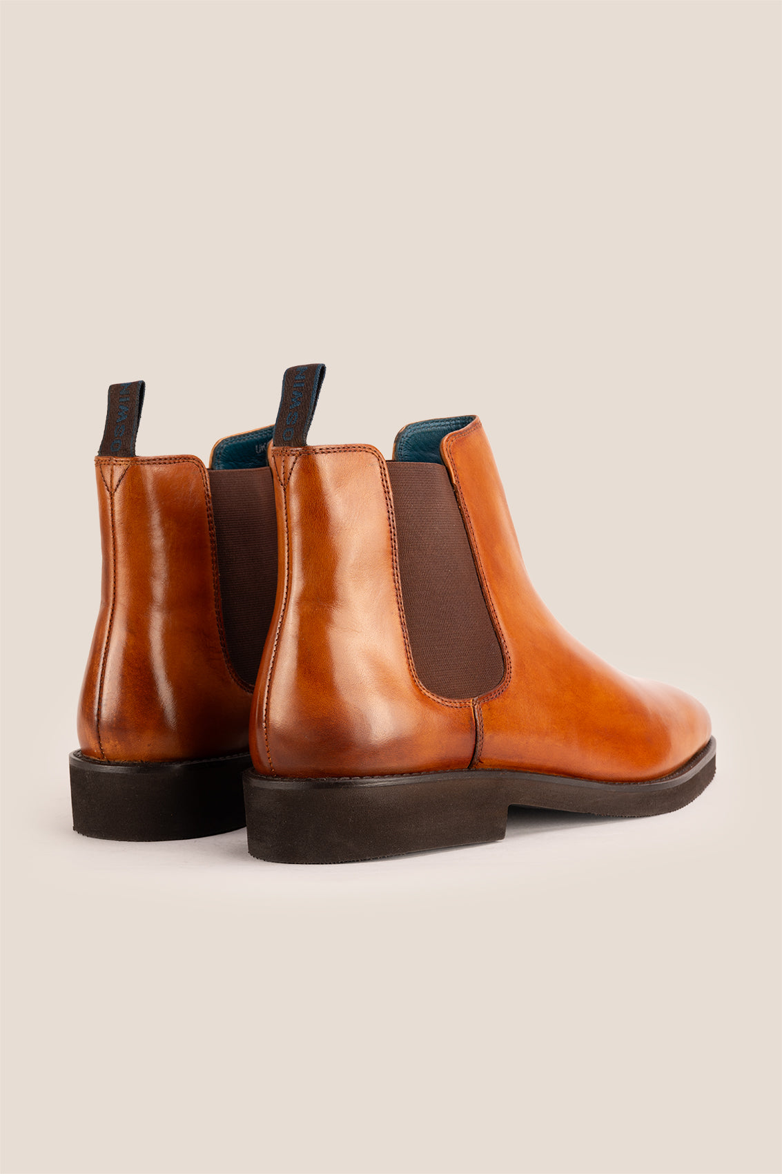 Michael tan leather Chelsea boots for men with elastic sides and pull tab, perfect for smart-casual and formal wear.