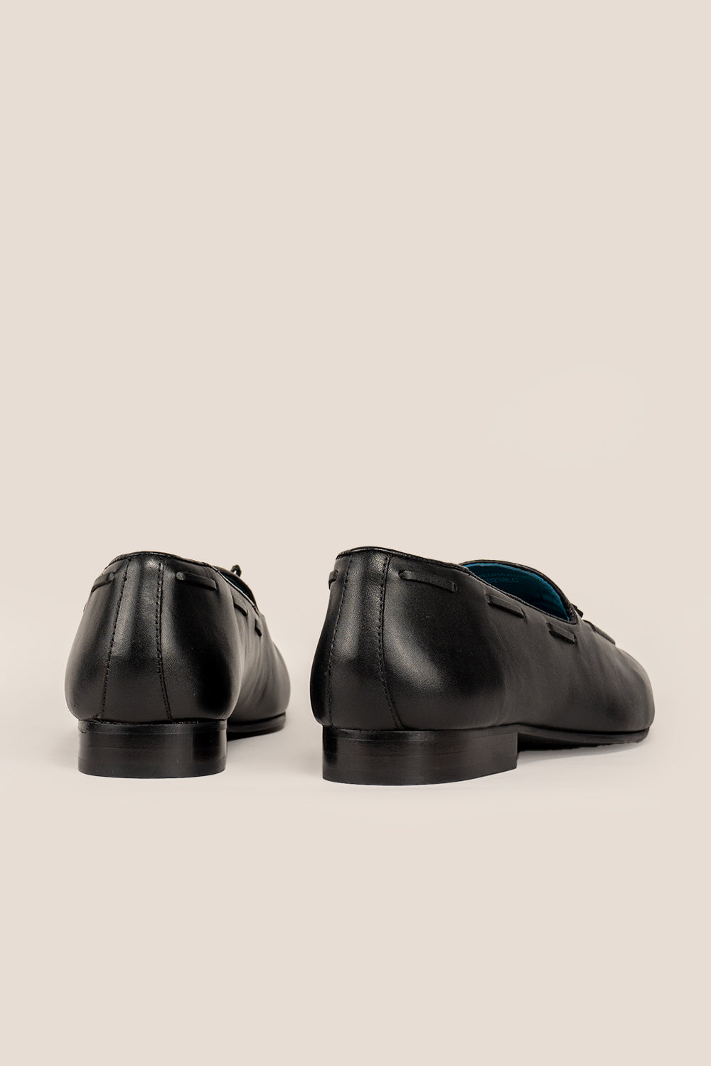 Alvin Black leather tassel loafers for men crafted from premium leather with classic tassel detail, ideal for formal and smart casual occasions.