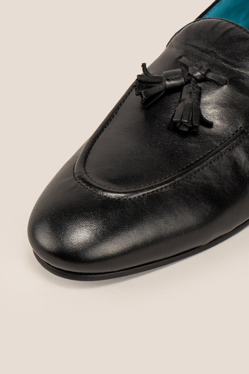 Alvin Black leather tassel loafers for men crafted from premium leather with classic tassel detail, ideal for formal and smart casual occasions.