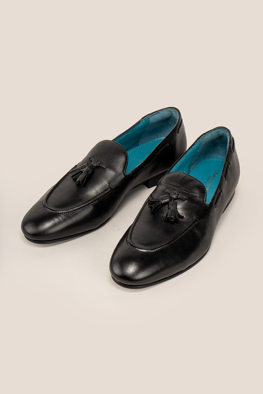 Alvin Black leather tassel loafers for men crafted from premium leather with classic tassel detail, ideal for formal and smart casual occasions.