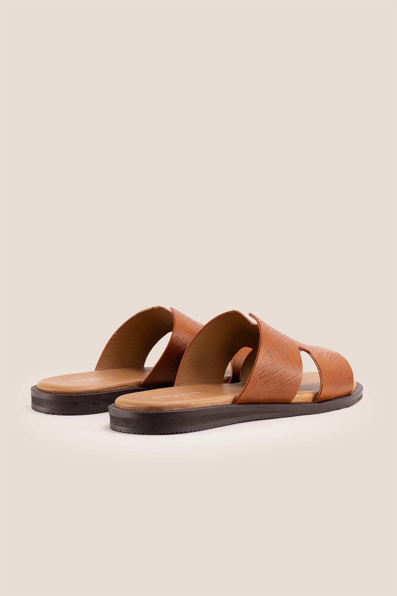 Men’s Phoenix Tan sandals in premium Saffiano leather featuring the signature hyde strap H-frame design.