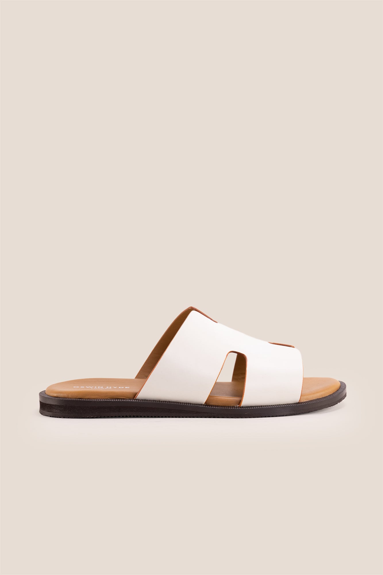 Men’s Phoenix White sandals in premium white leather featuring a minimalist hyde strap H-frame design.