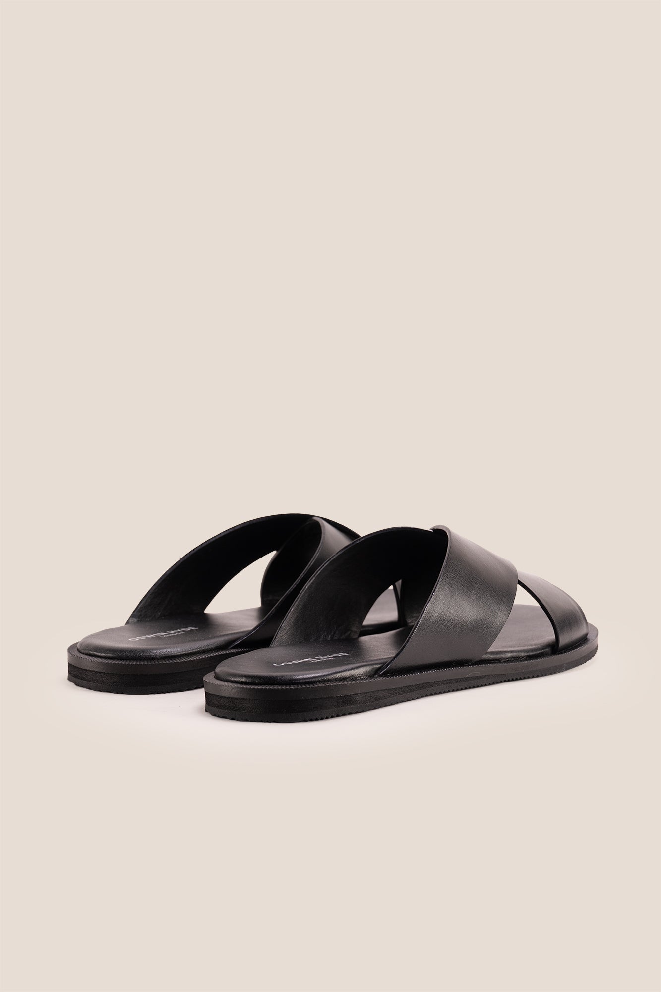 Men’s Ollie Black sandals featuring a bold, wide criss-cross strap design in smooth high-grade tan leather.
