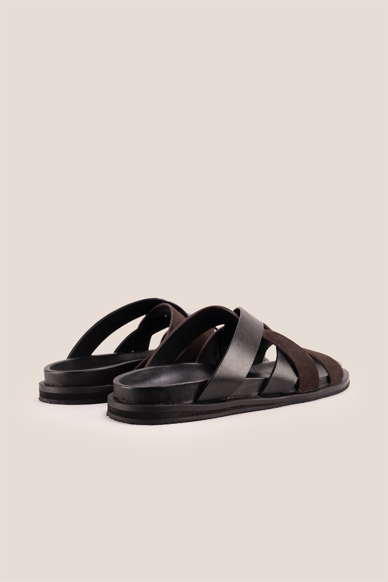 Men’s Rowan Brown slide sandals featuring a textured brown suede X-strap design and a cushioned sole.
