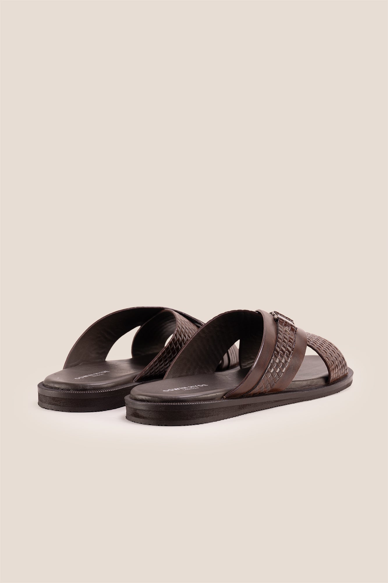 Aiden Brown men’s leather sandals with a unique woven criss-cross strap design.