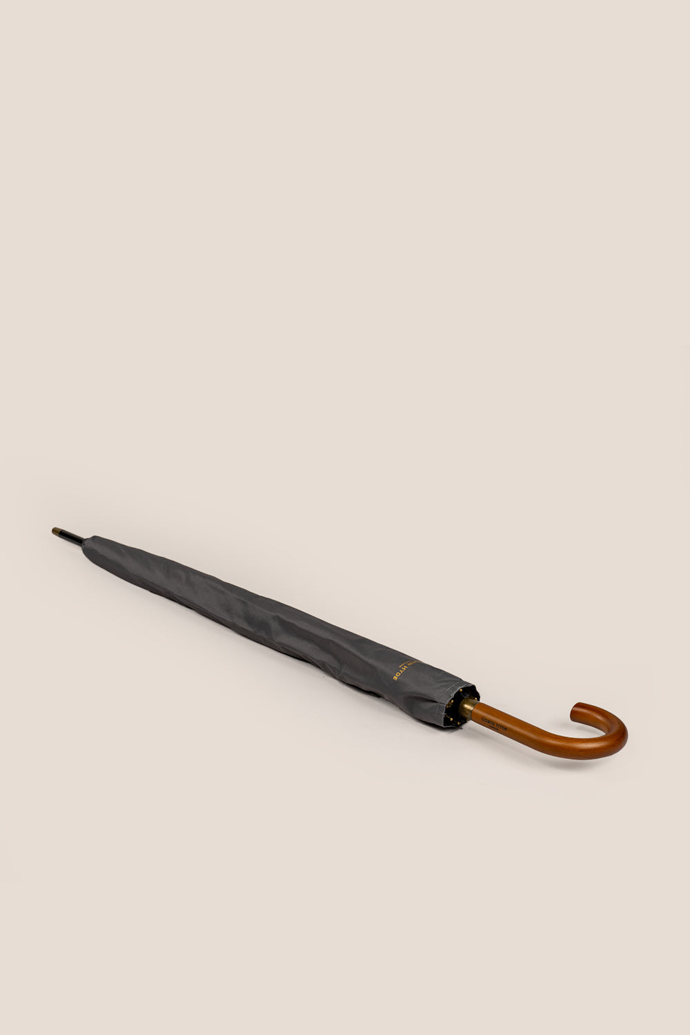 Justin Grey men’s windproof folding umbrella with J-handle, designed for durability, ease of use, and stylish protection against the elements.