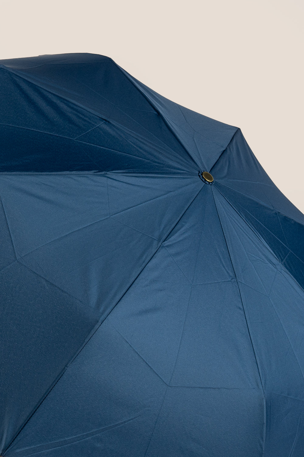 Jasper Blue folding umbrella with handcrafted wooden J-handle, elegant design, lightweight frame, and matching carry pouch for stylish all-weather use.