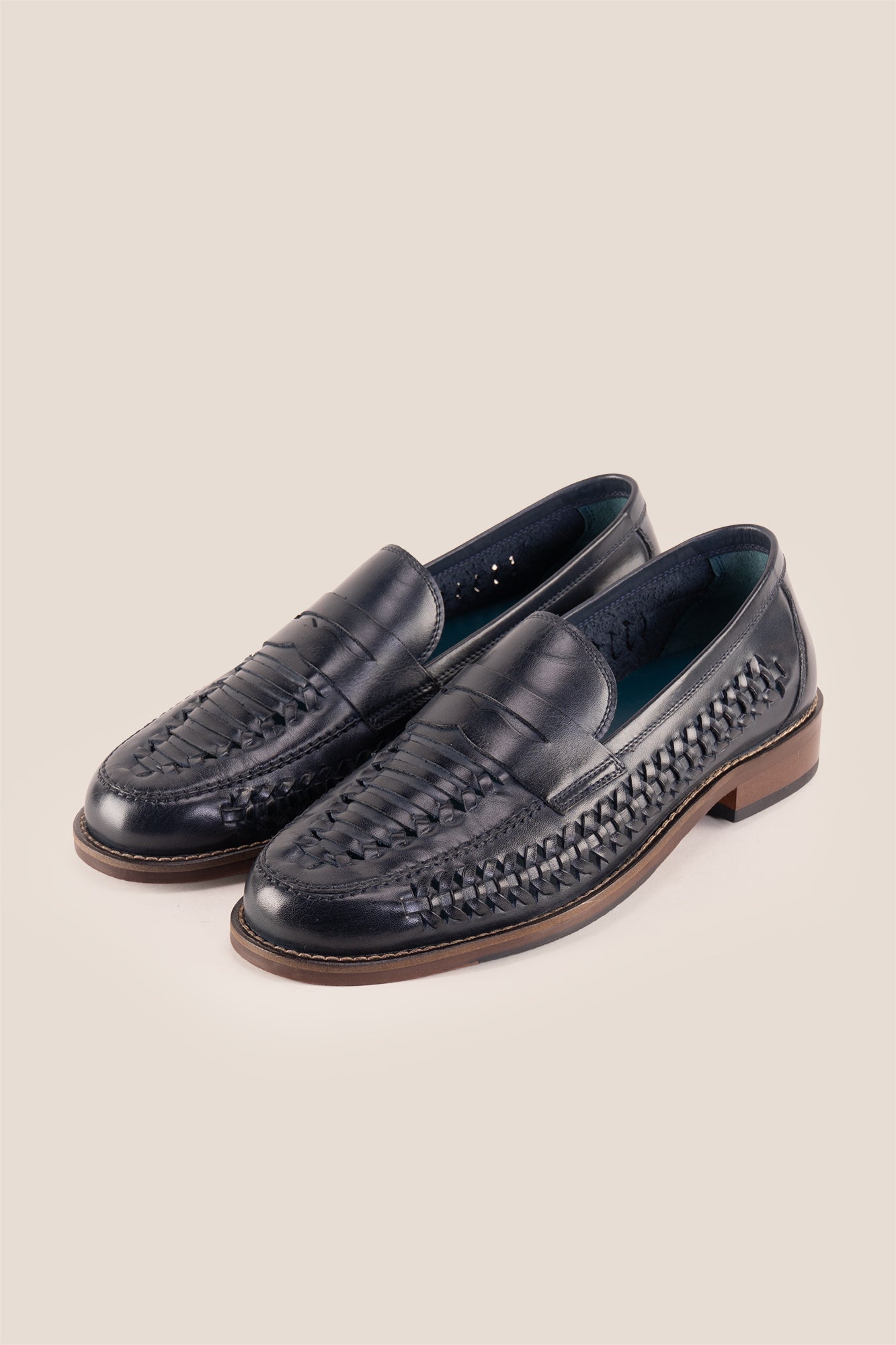 Finley navy woven leather loafers for men, featuring premium craftsmanship, intricate weave detail, and a refined, durable finish