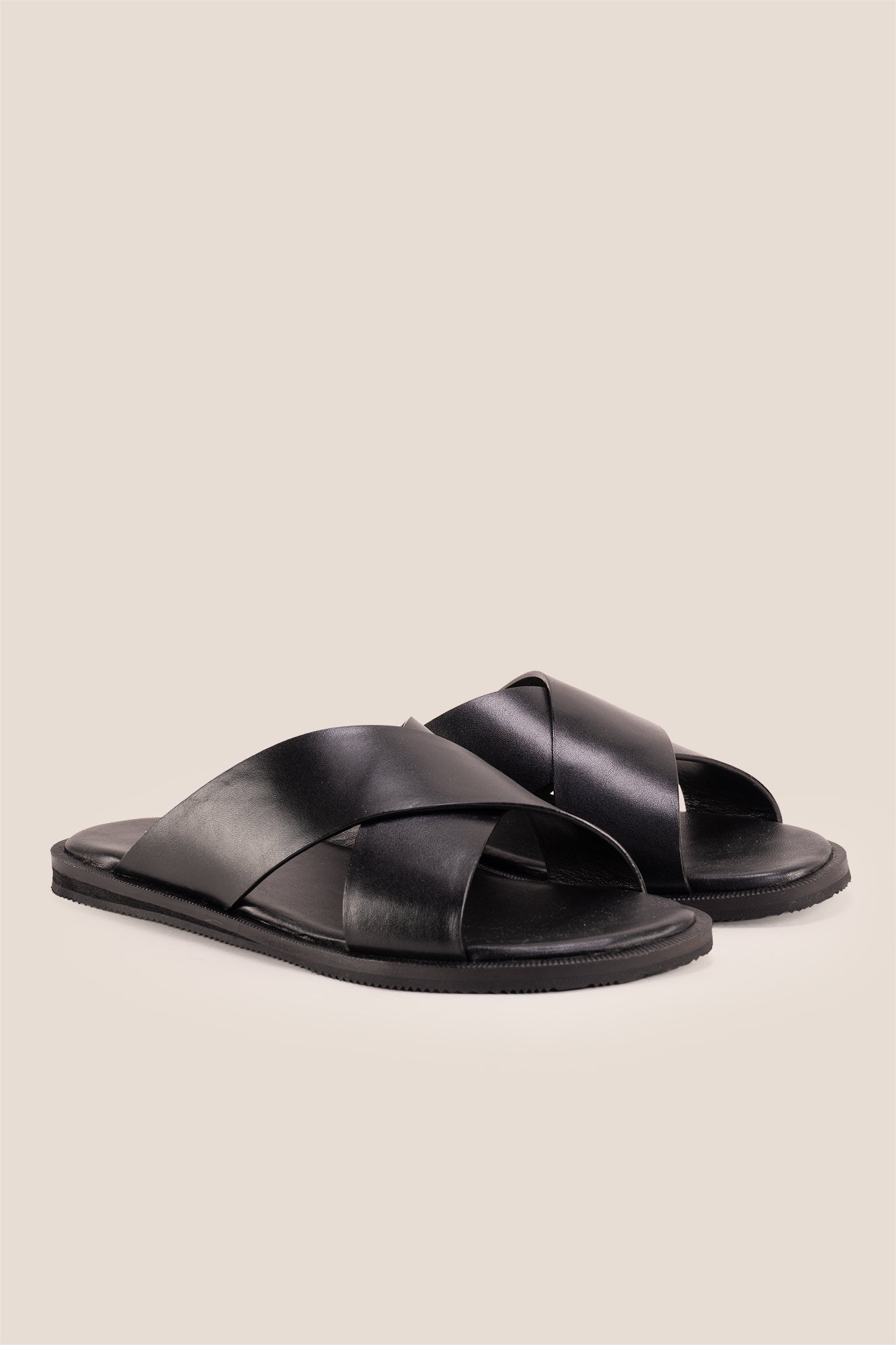 Men’s Ollie Black sandals featuring a bold, wide criss-cross strap design in smooth high-grade tan leather.