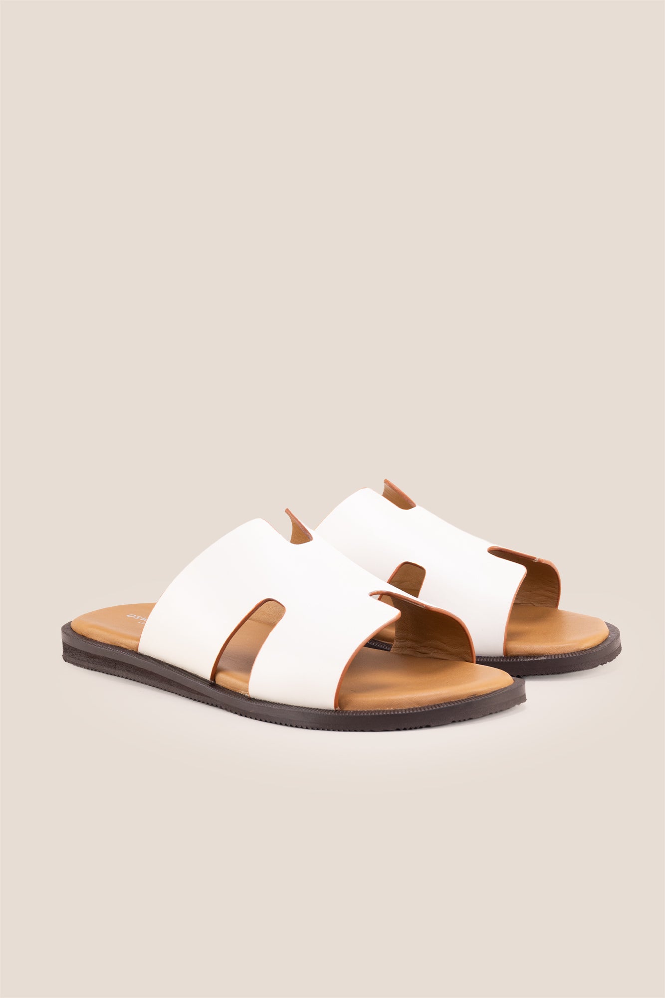 Men’s Phoenix White sandals in premium white leather featuring a minimalist hyde strap H-frame design.