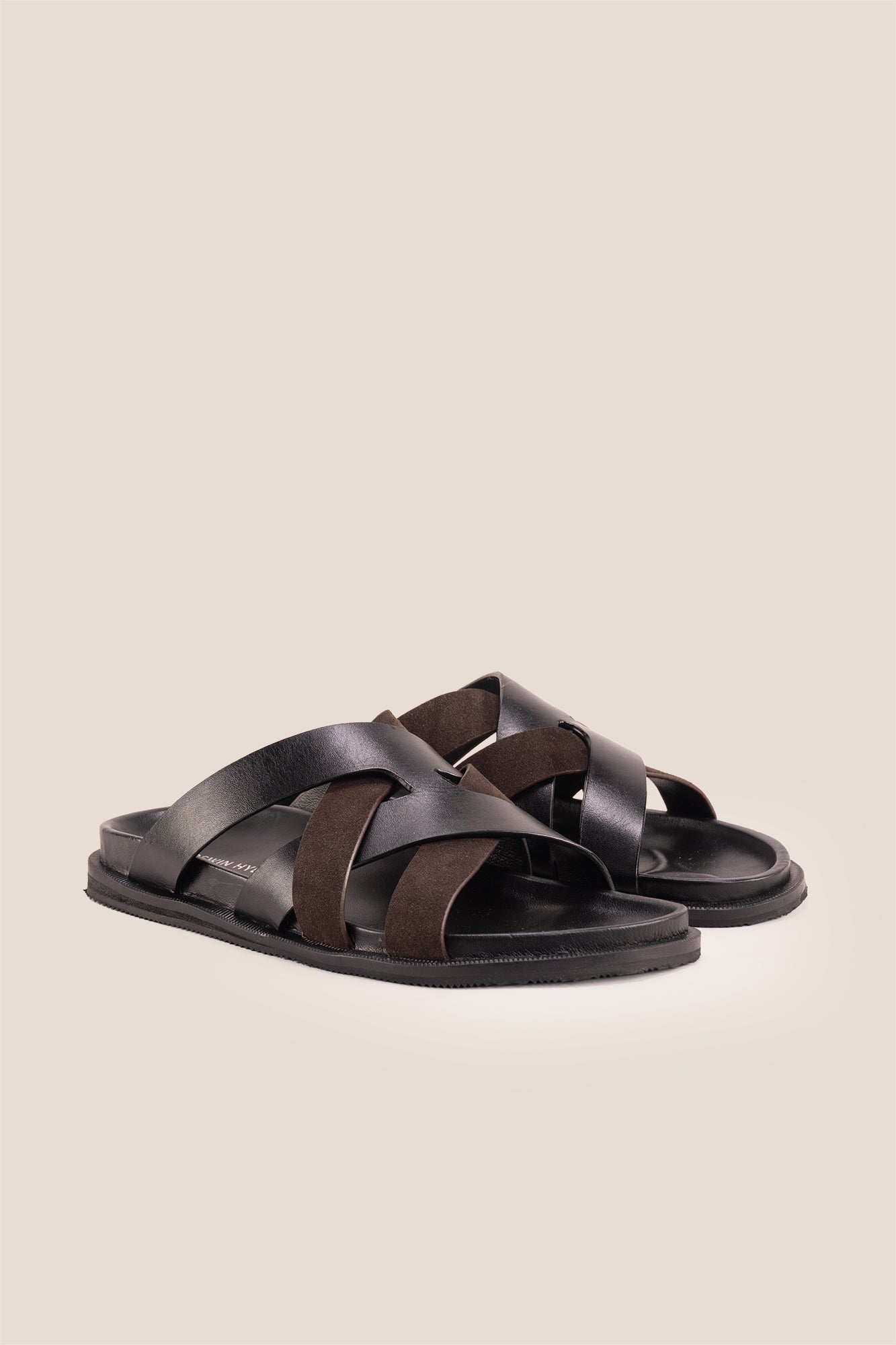 Men’s Rowan Brown slide sandals featuring a textured brown suede X-strap design and a cushioned sole.