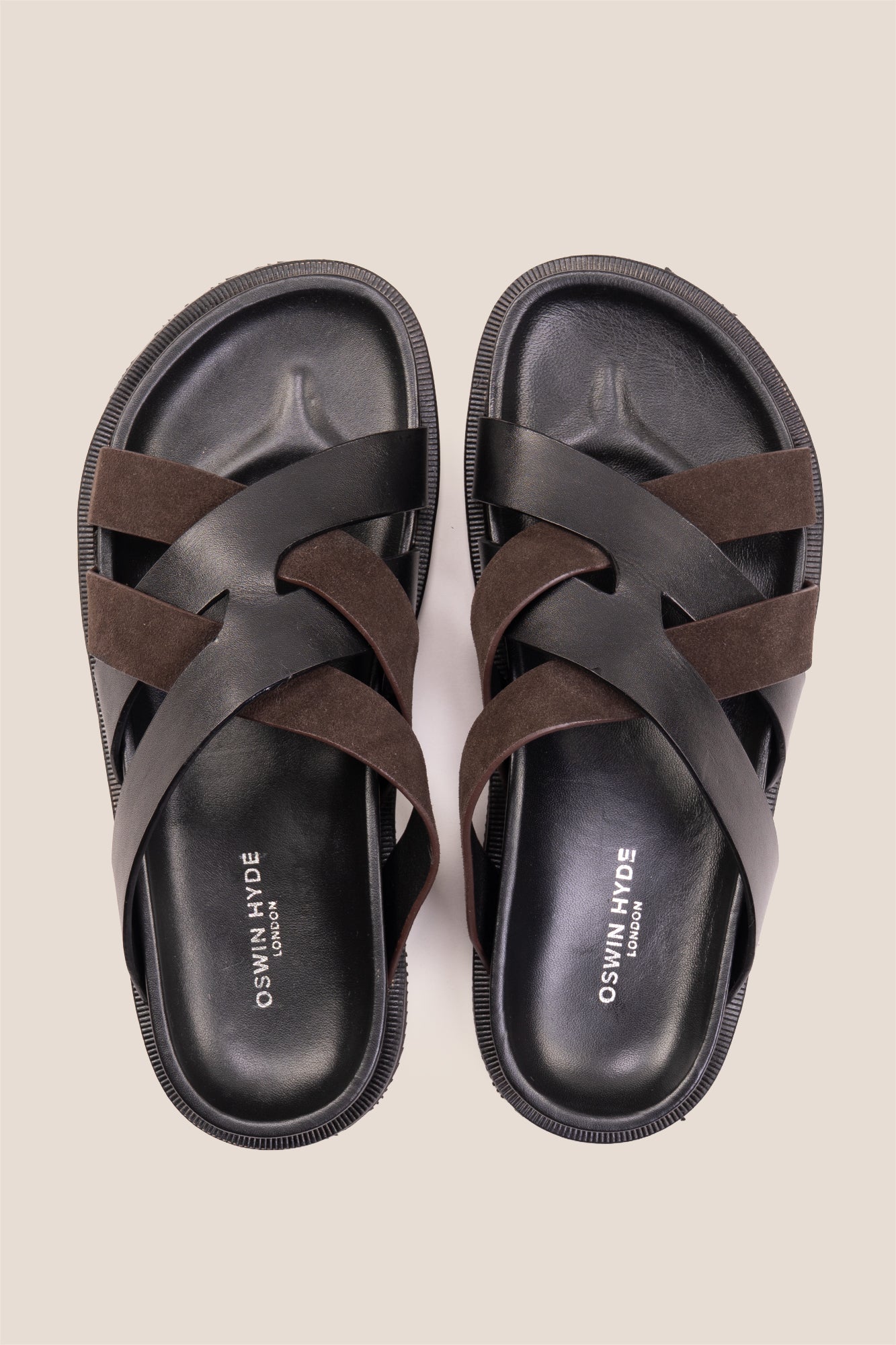 Men’s Rowan Brown slide sandals featuring a textured brown suede X-strap design and a cushioned sole.