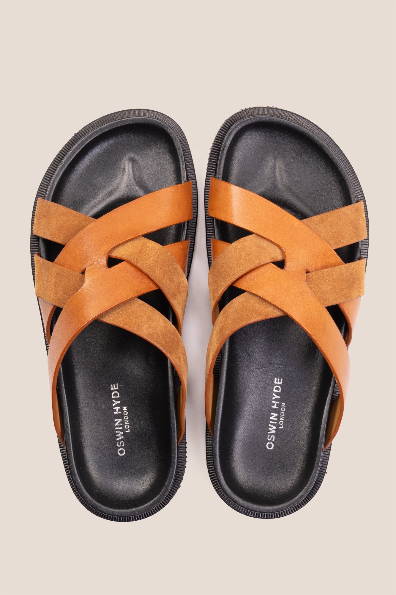 Men’s Rowan Tan slide sandals featuring a soft suede leather X-strap design and an earthy tan finish.