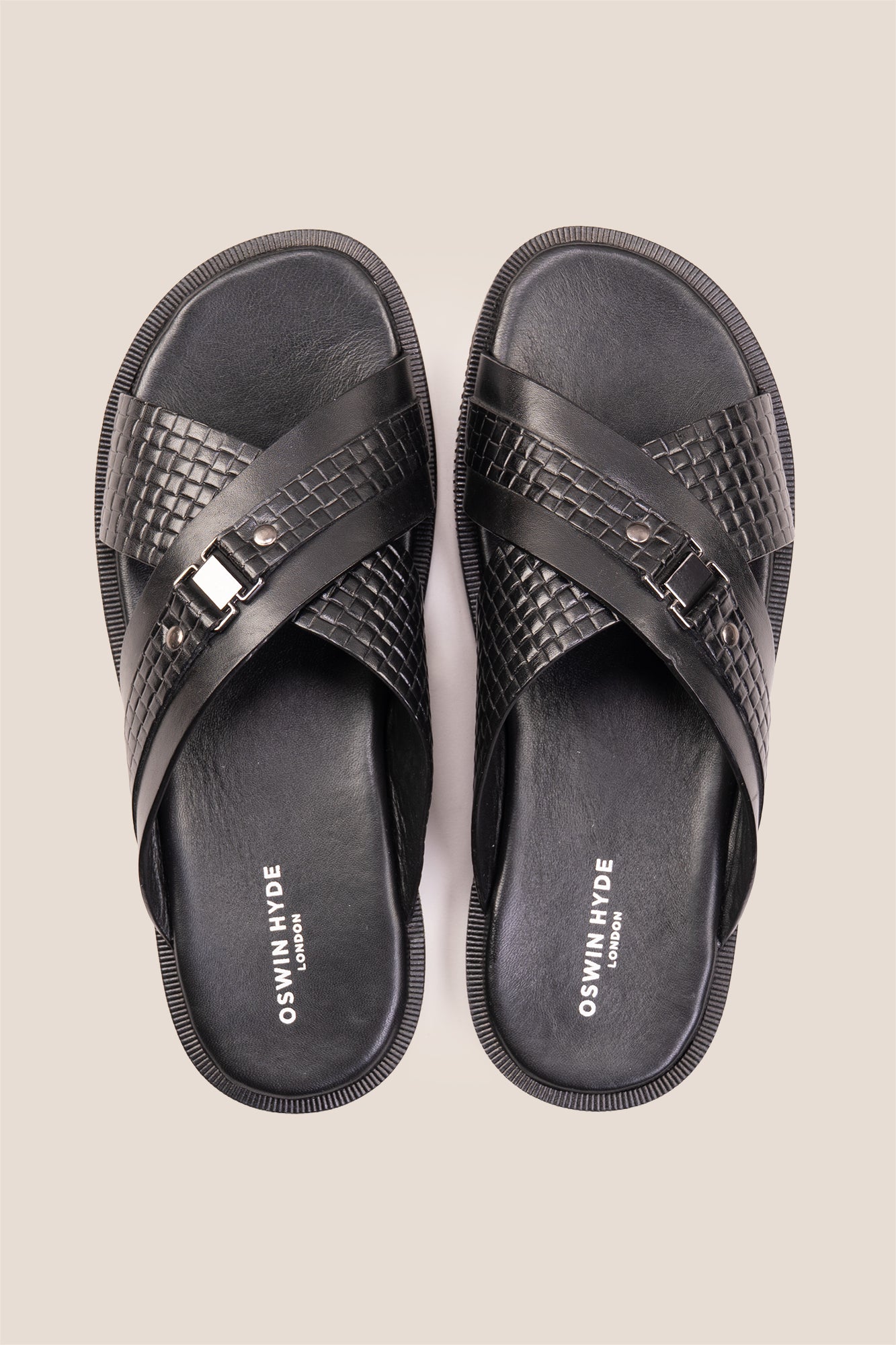 Aiden Black men’s leather sandals with a unique woven criss-cross strap design.