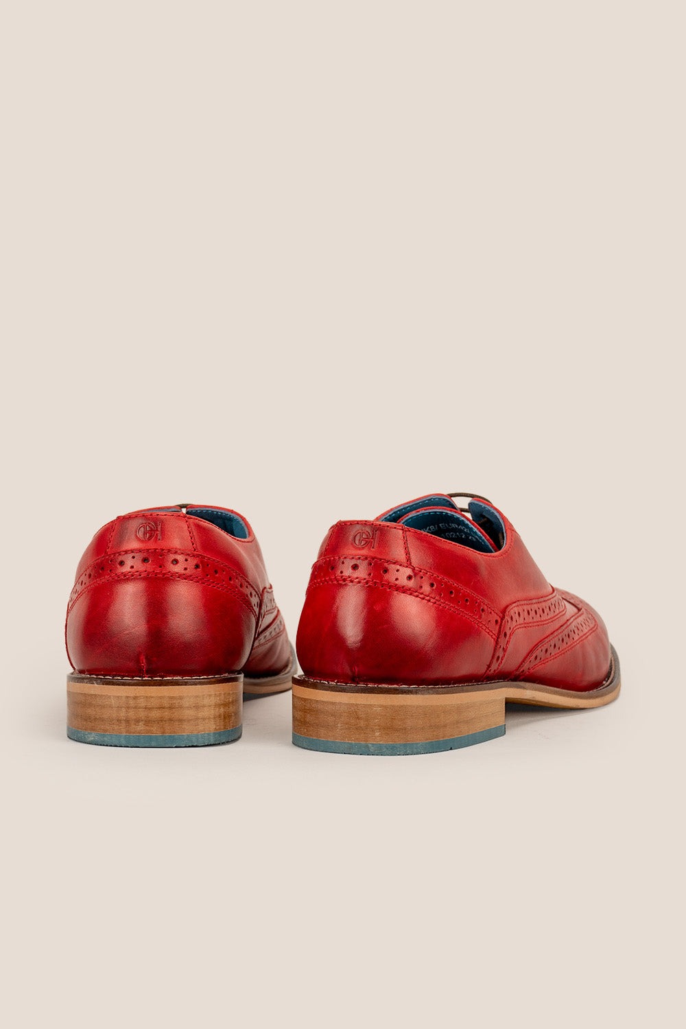 Winston cherry leather Oxford brogues for men featuring wingtip perforations and polished finish, ideal for formal and smart-casual occasions.