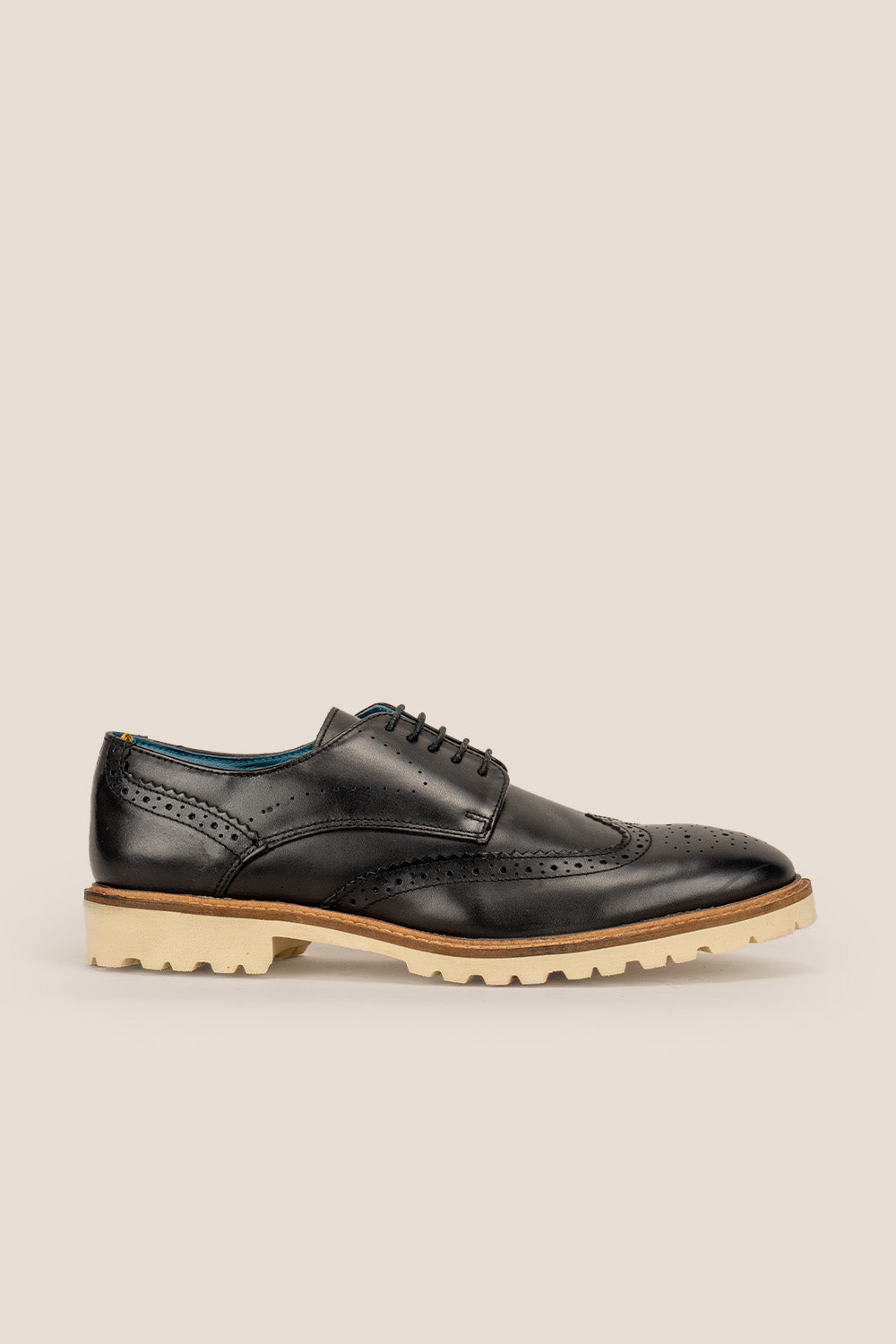 Eli black wide fit brogue men’s leather shoes featuring wingtip detail, premium leather construction, and a comfortable smart everyday silhouette.