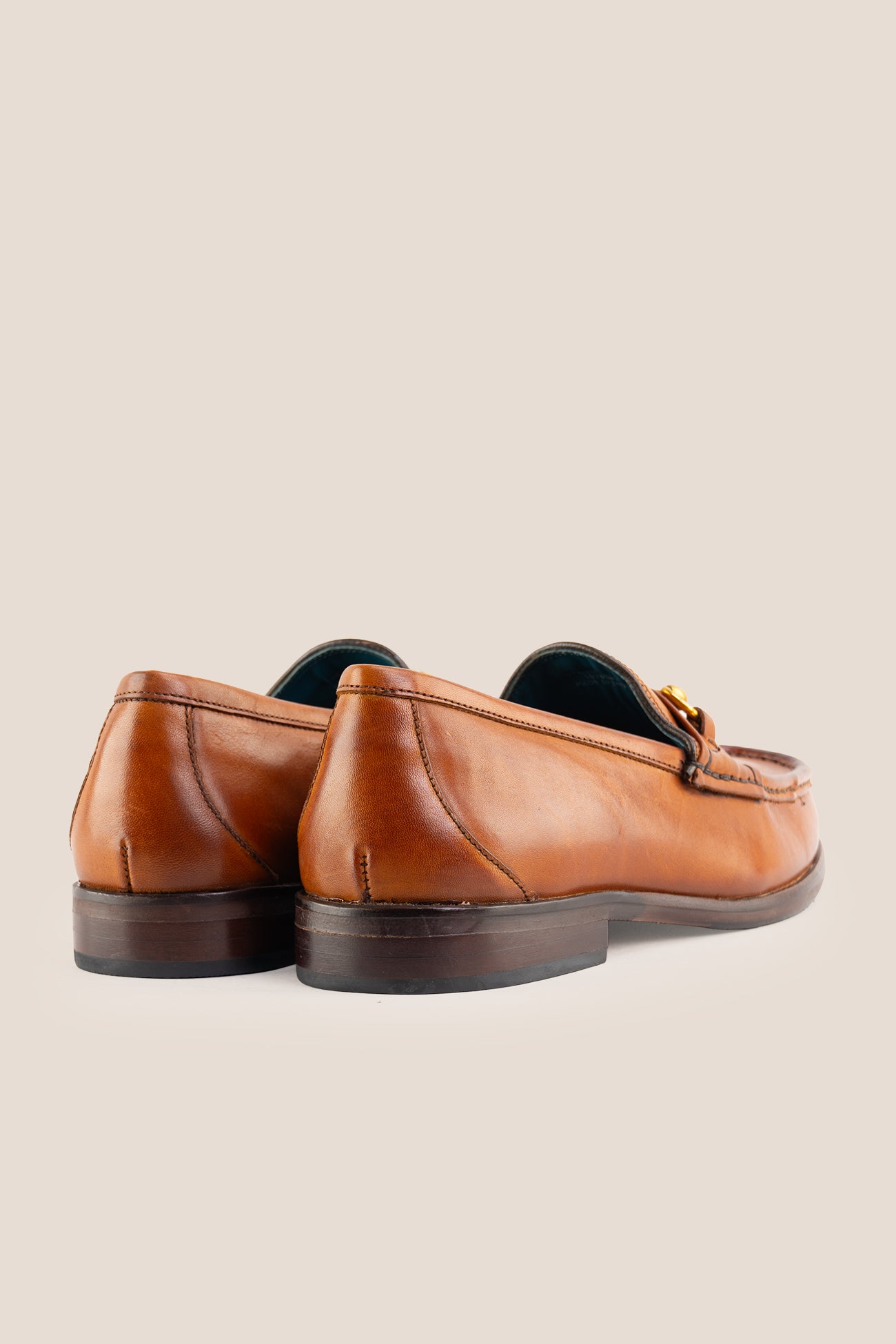 Pair of Oswin Hyde Samuel Tan leather horsebit loafers featuring gold bit hardware.