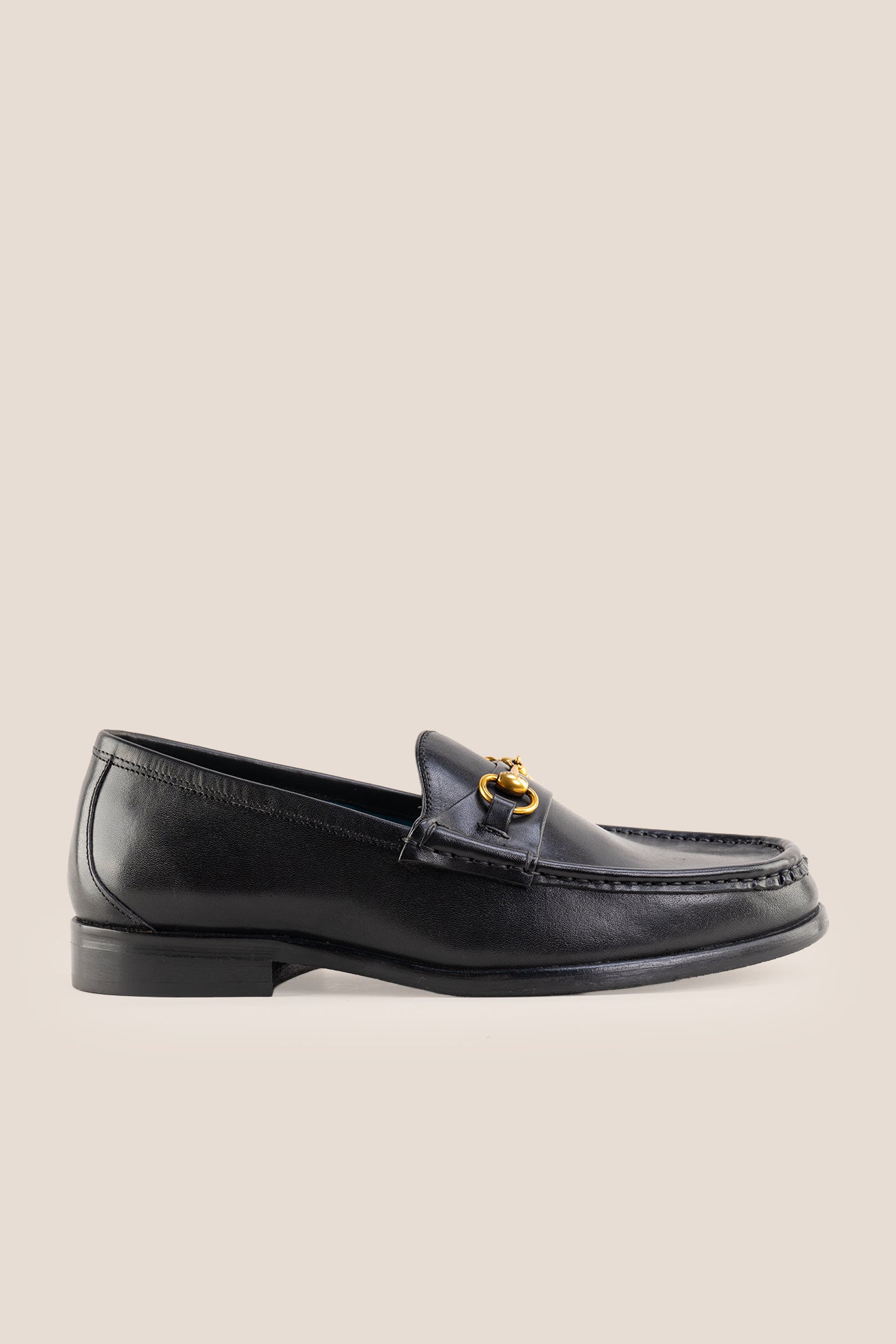 Pair of Oswin Hyde Samuel black leather horsebit loafers with gold buckle detail and teal lining.