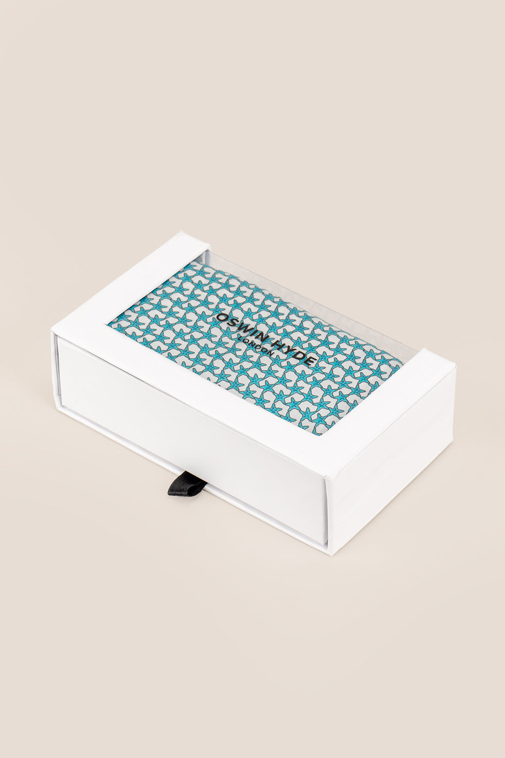 Blue silk pocket square handkerchief with a blue star print and four versatile folds, ideal for wedding, business or refined casual wear.