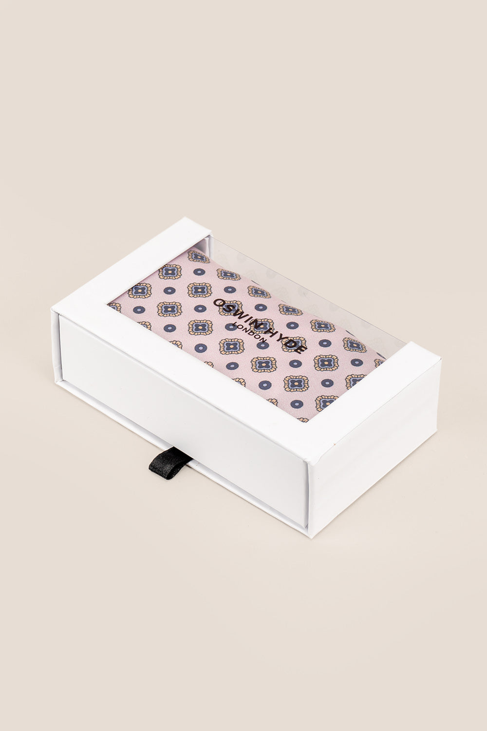 Salmon silk pocket square for men with intricate geometric pattern, crafted from luxurious silk for formal and smart-casual occasions.