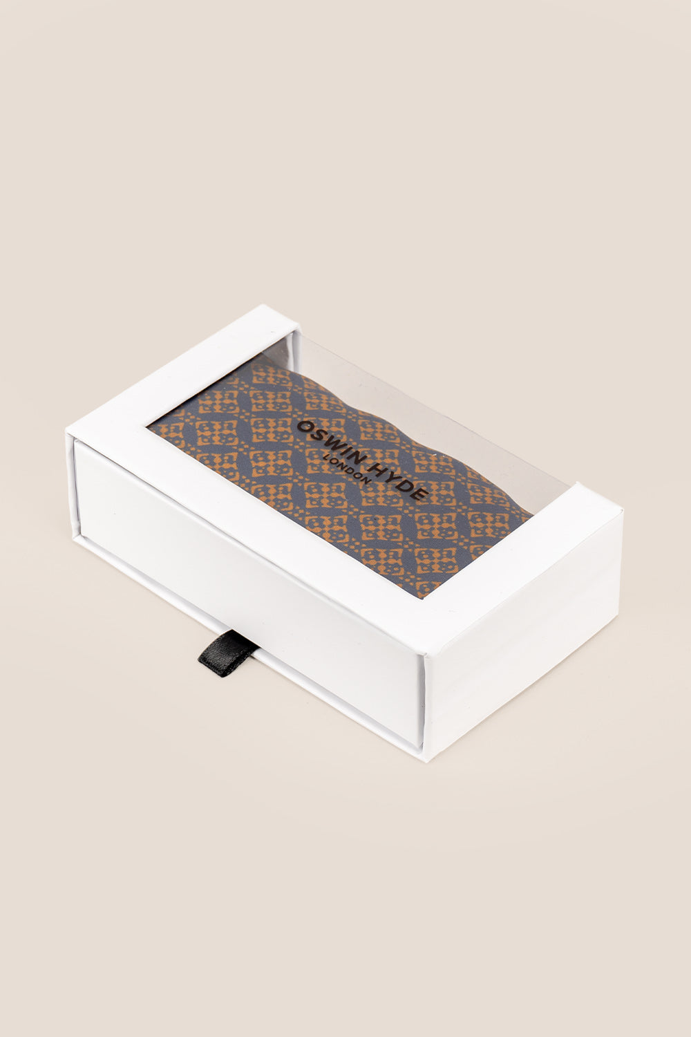 Men’s orange silk handkerchief with an intricate geometric pattern, crafted for weddings, formal occasions, or stylish smart dressing.