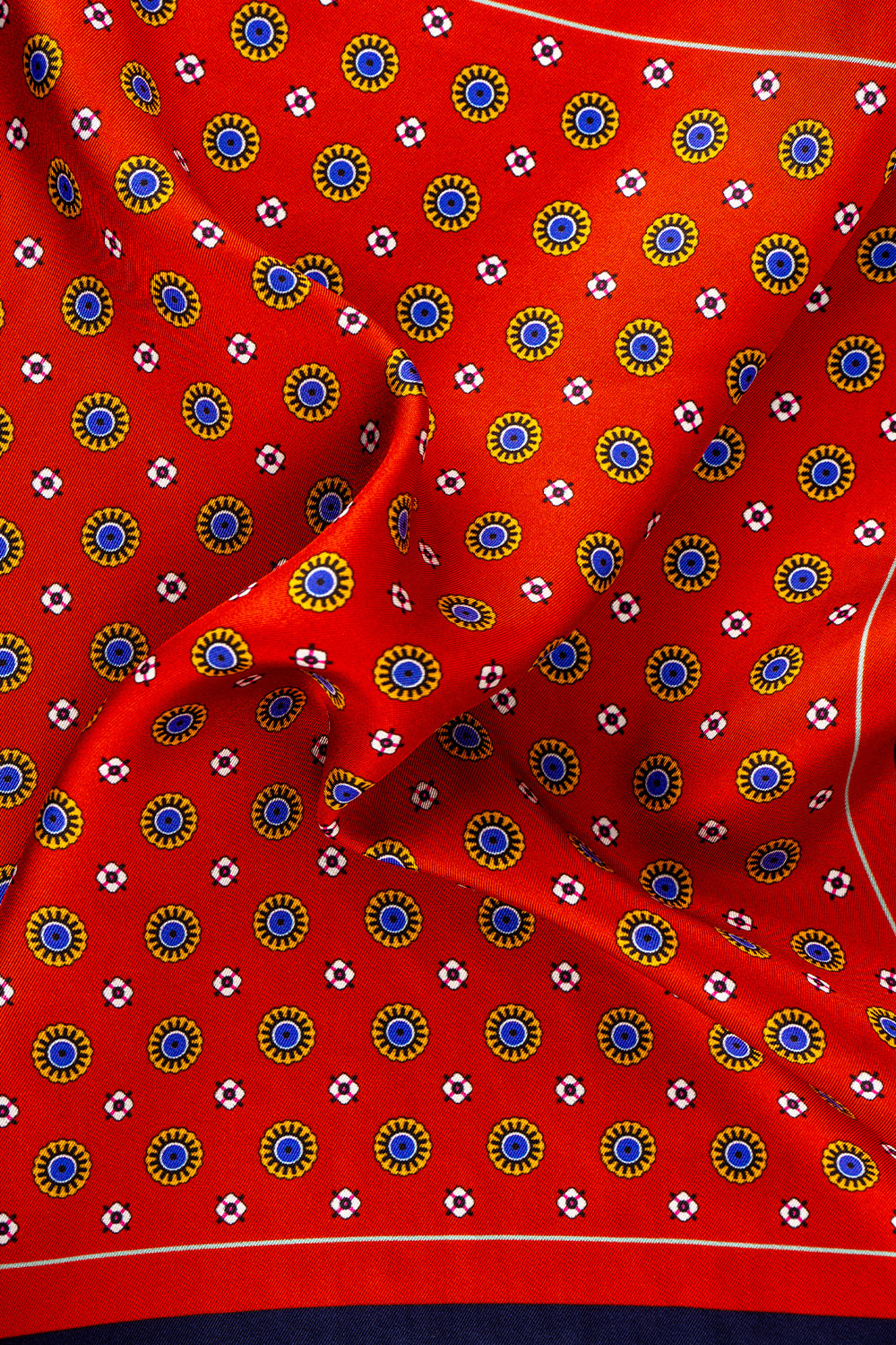 Men’s red silk pocket square with an intricate geometric pattern, crafted for weddings, formal occasions, or sophisticated smart attire.