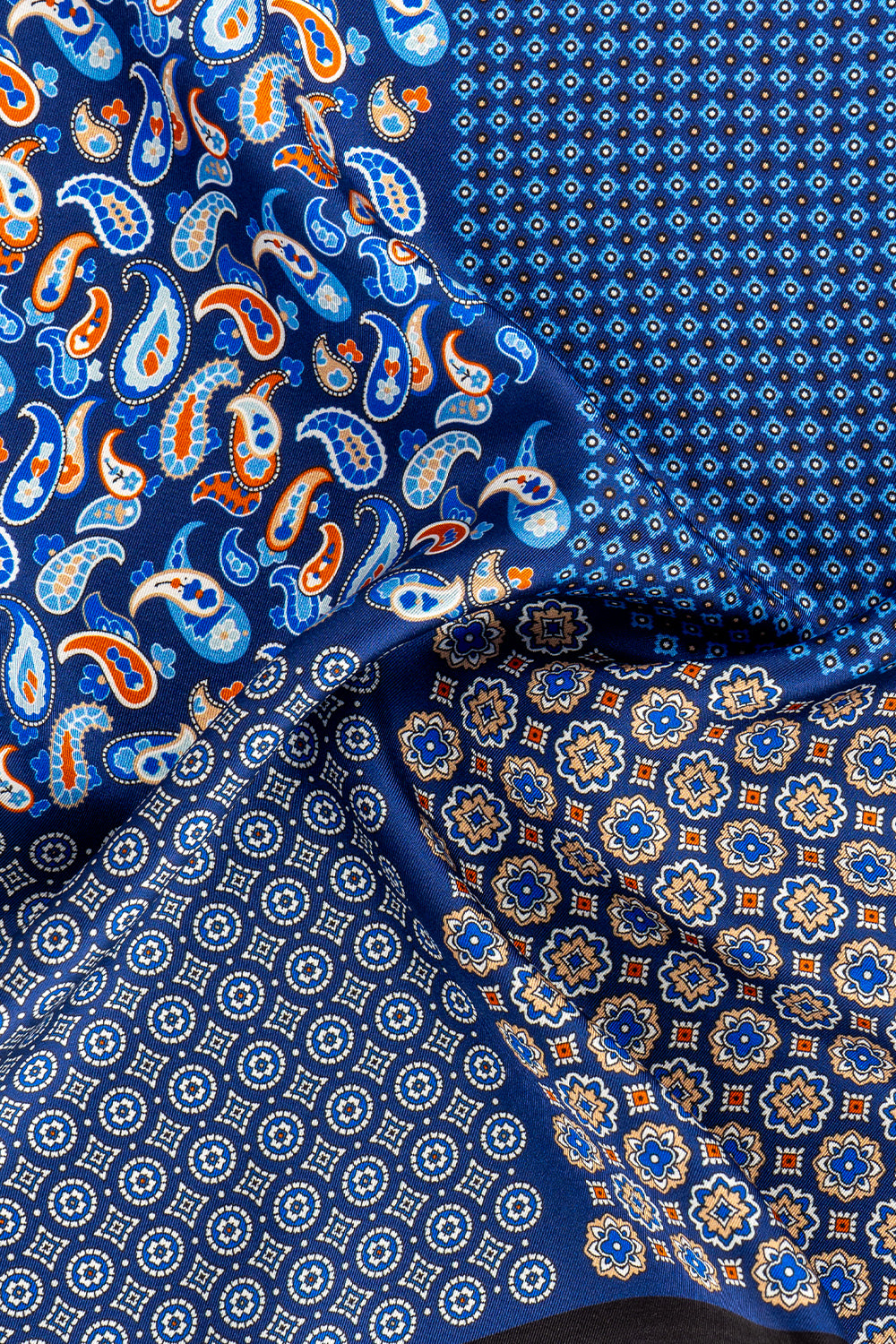 Men’s navy silk pocket square handkerchief with four versatile folds and intricate pattern, ideal for weddings, formal occasions, or smart casual wear.