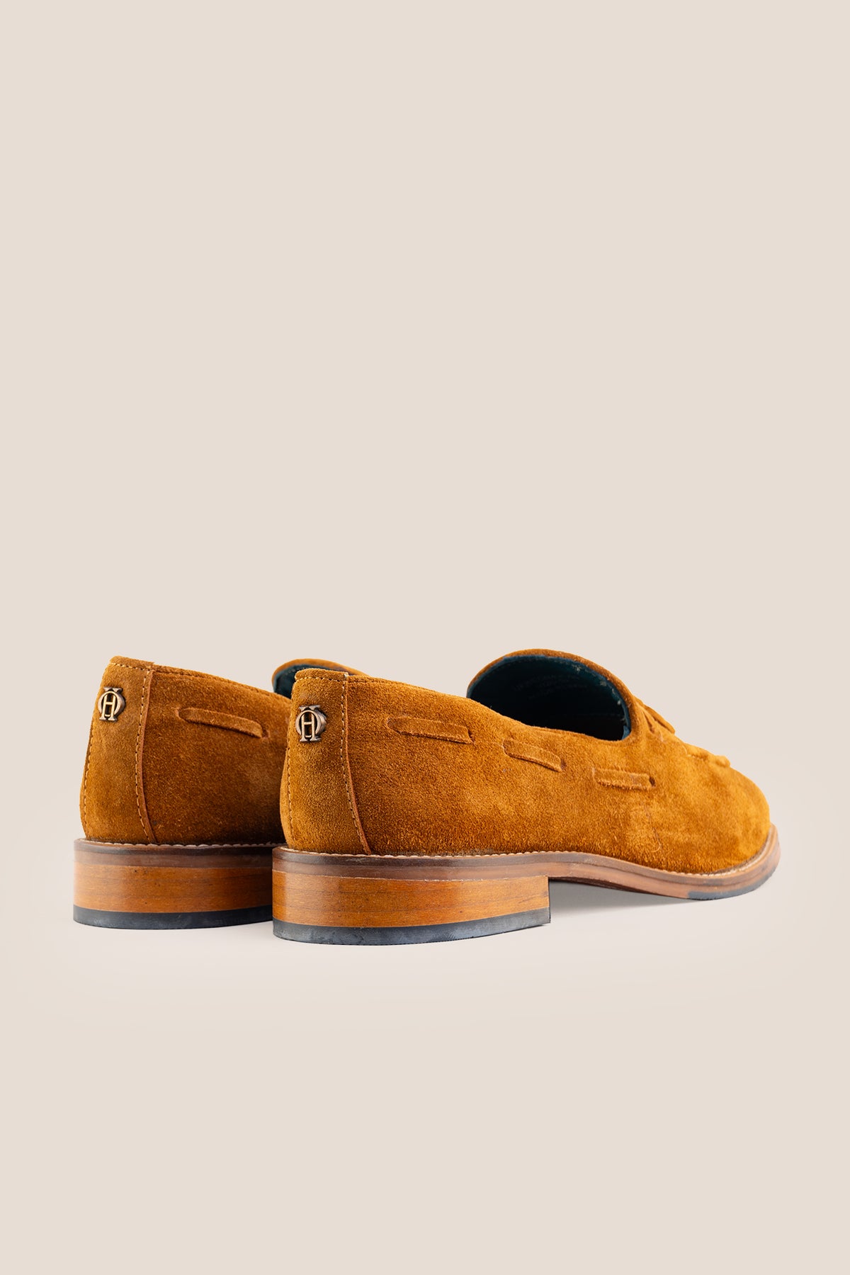 Men's Issac Tobacco Suede tassel loafers crafted from premium suede with a cushioned footbed and slip-on design.
