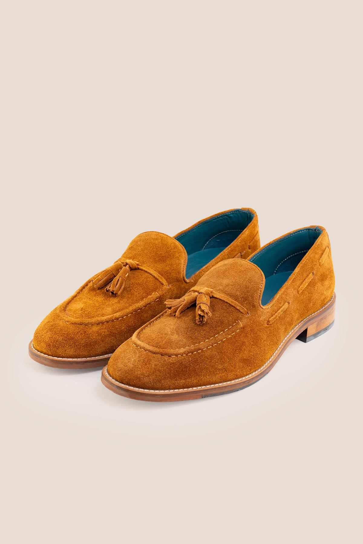 Men's Issac Tobacco Suede tassel loafers crafted from premium suede with a cushioned footbed and slip-on design.