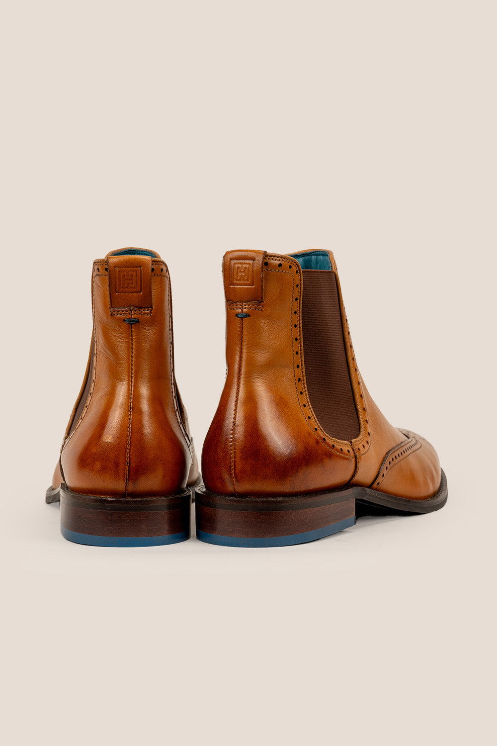 Harry Tan Chelsea brogue boots for men made from premium leather with lambskin lining and handmade sole, combining classic style and modern comfort.