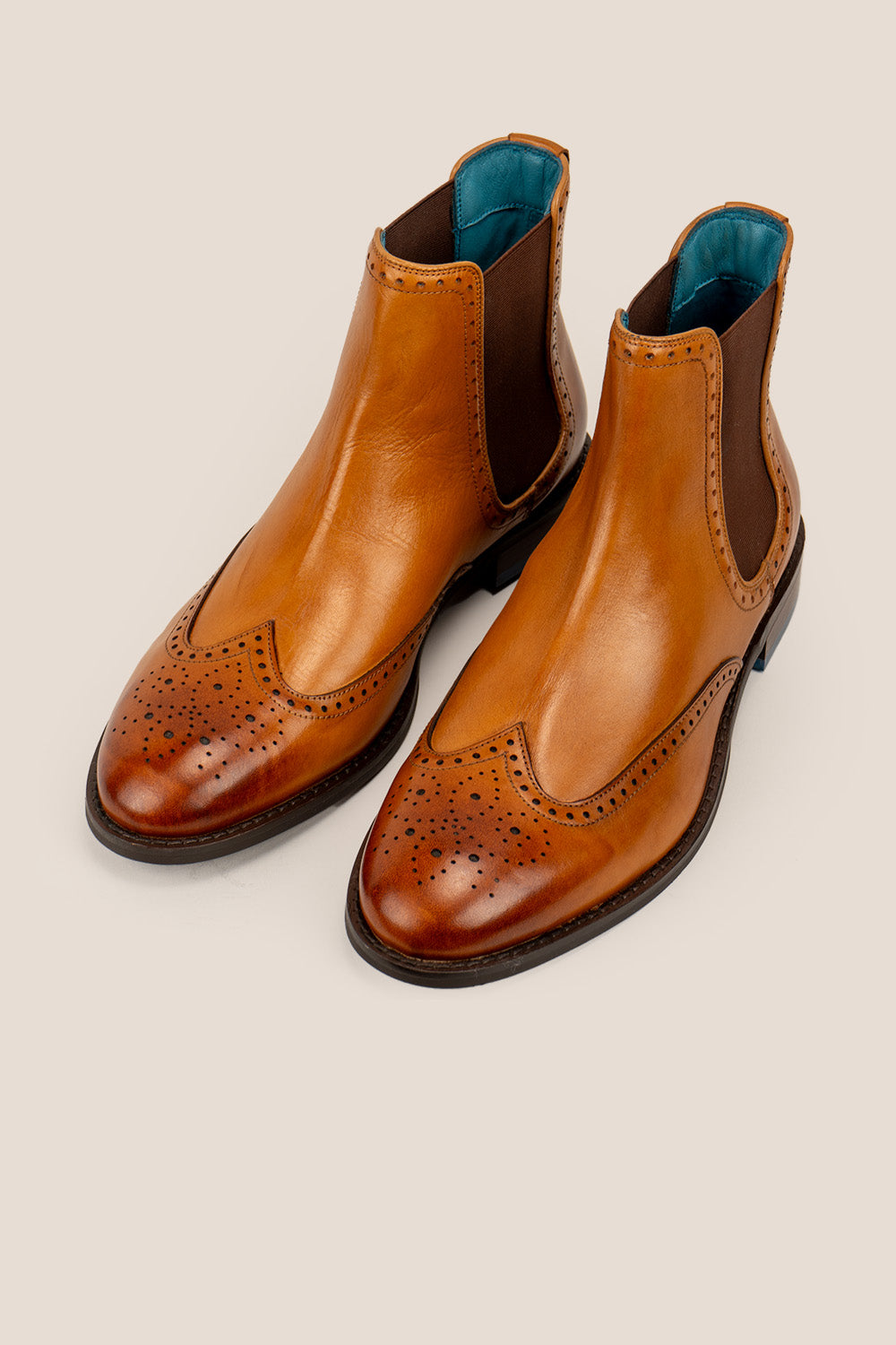 Harry Tan Chelsea brogue boots for men made from premium leather with lambskin lining and handmade sole, combining classic style and modern comfort.