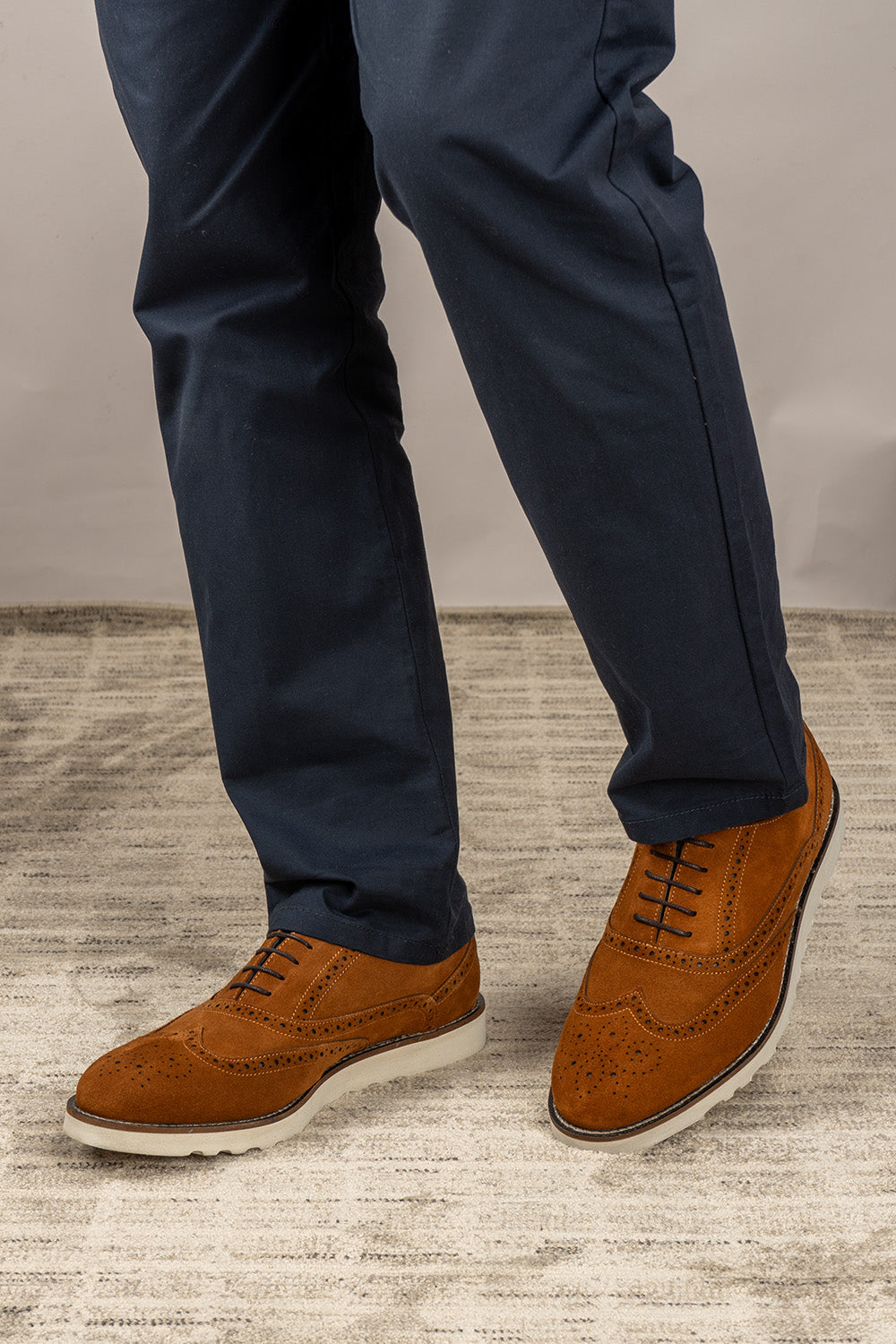 Men’s Tyler oxford brogue trainers in tobacco suede with classic perforated details and rubber sole—a refined twist on modern casual footwear.