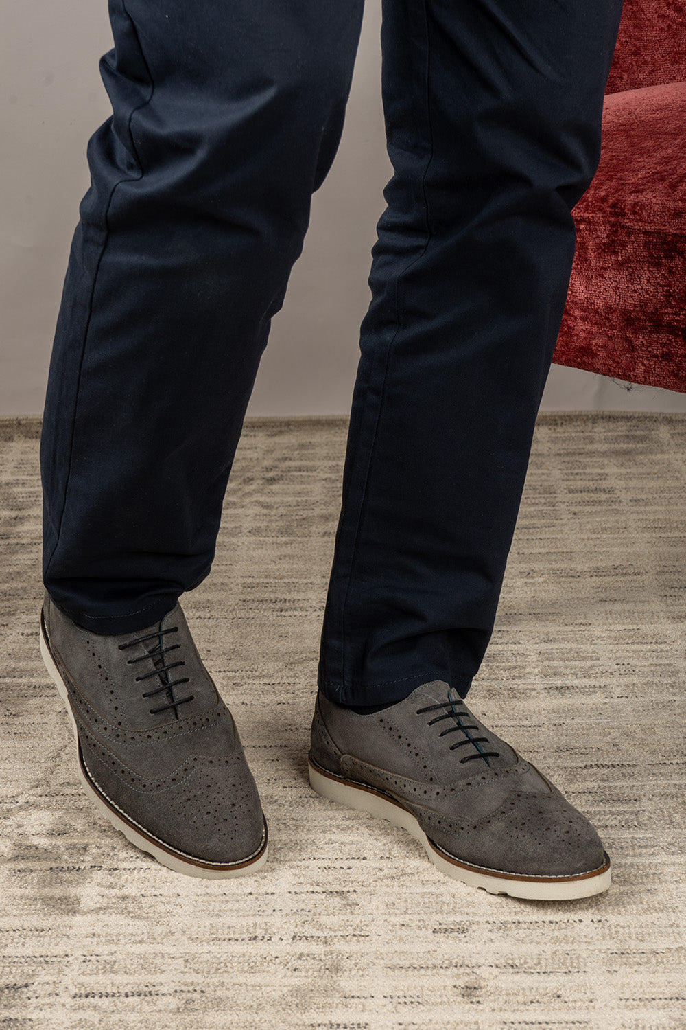 Men’s Tyler grey suede Oxford brogue trainer shoes with perforated detailing, leather lining, and a sleek white sole for elegant everyday wear.