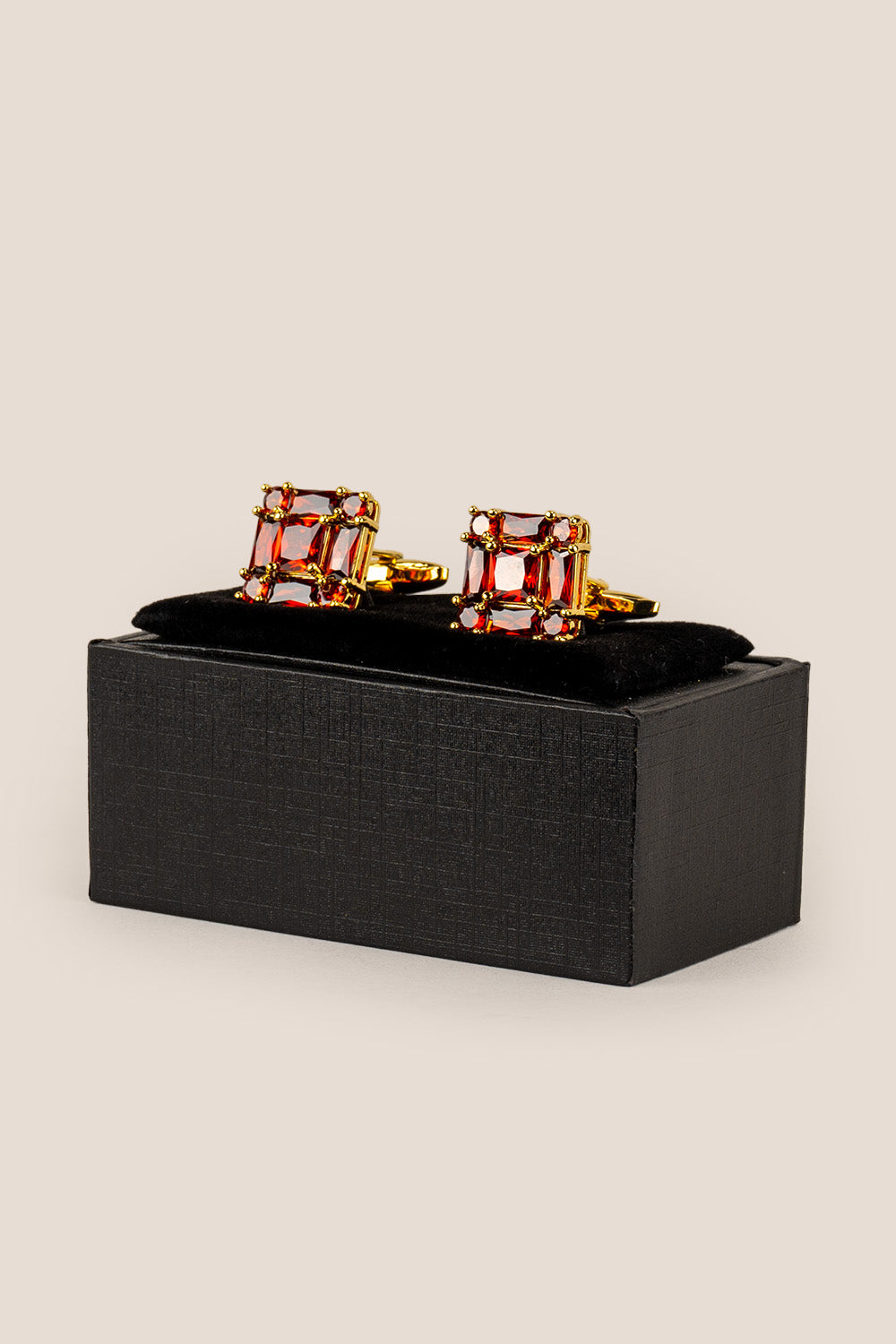 Close‑up of Zirc Ruby men’s cufflinks with deep ruby gemstones set in intricate metalwork for formal sophistication and luxury.