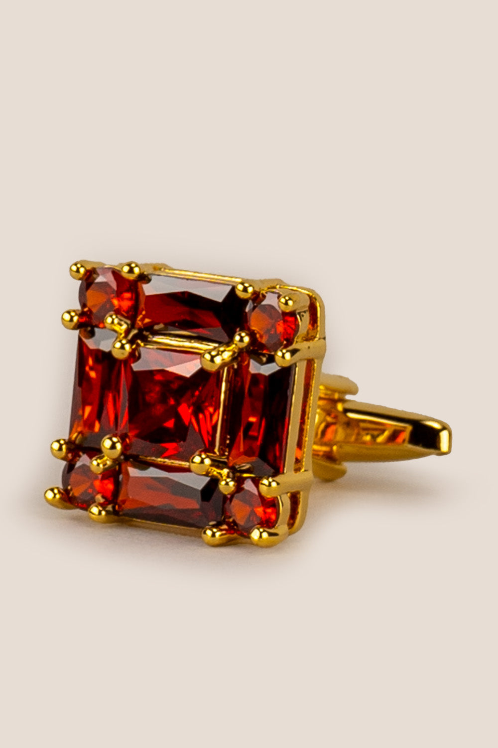 Close‑up of Zirc Ruby men’s cufflinks with deep ruby gemstones set in intricate metalwork for formal sophistication and luxury.