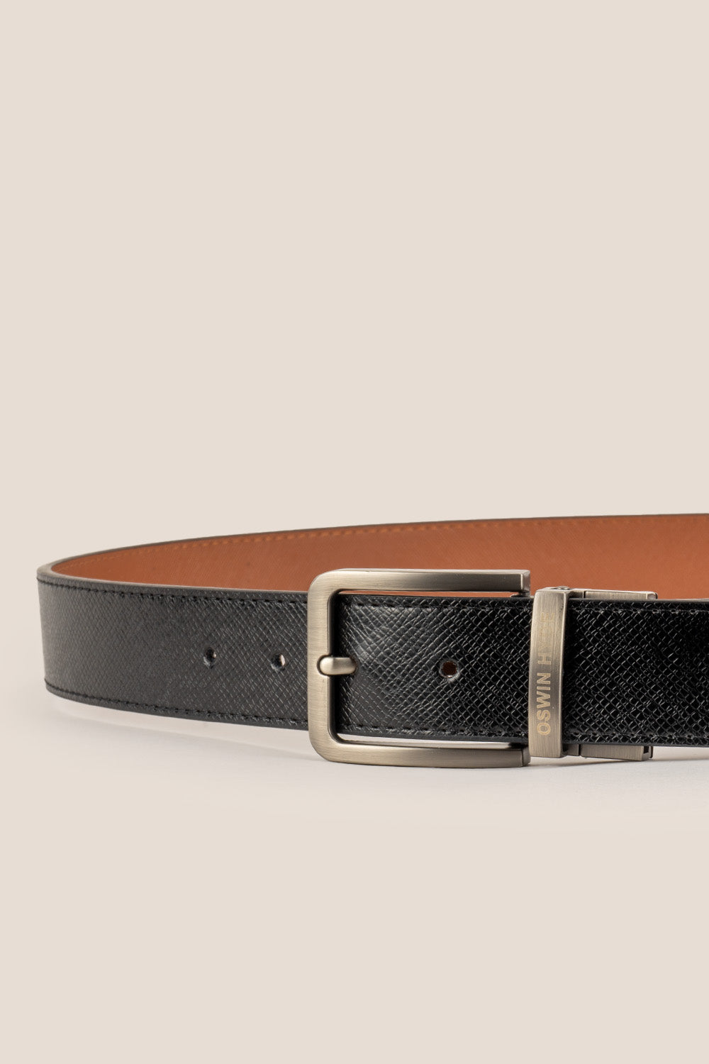 Men’s Claud reversible belt in black and navy premium leather with a sleek polished buckle, designed for versatile and sophisticated styling.