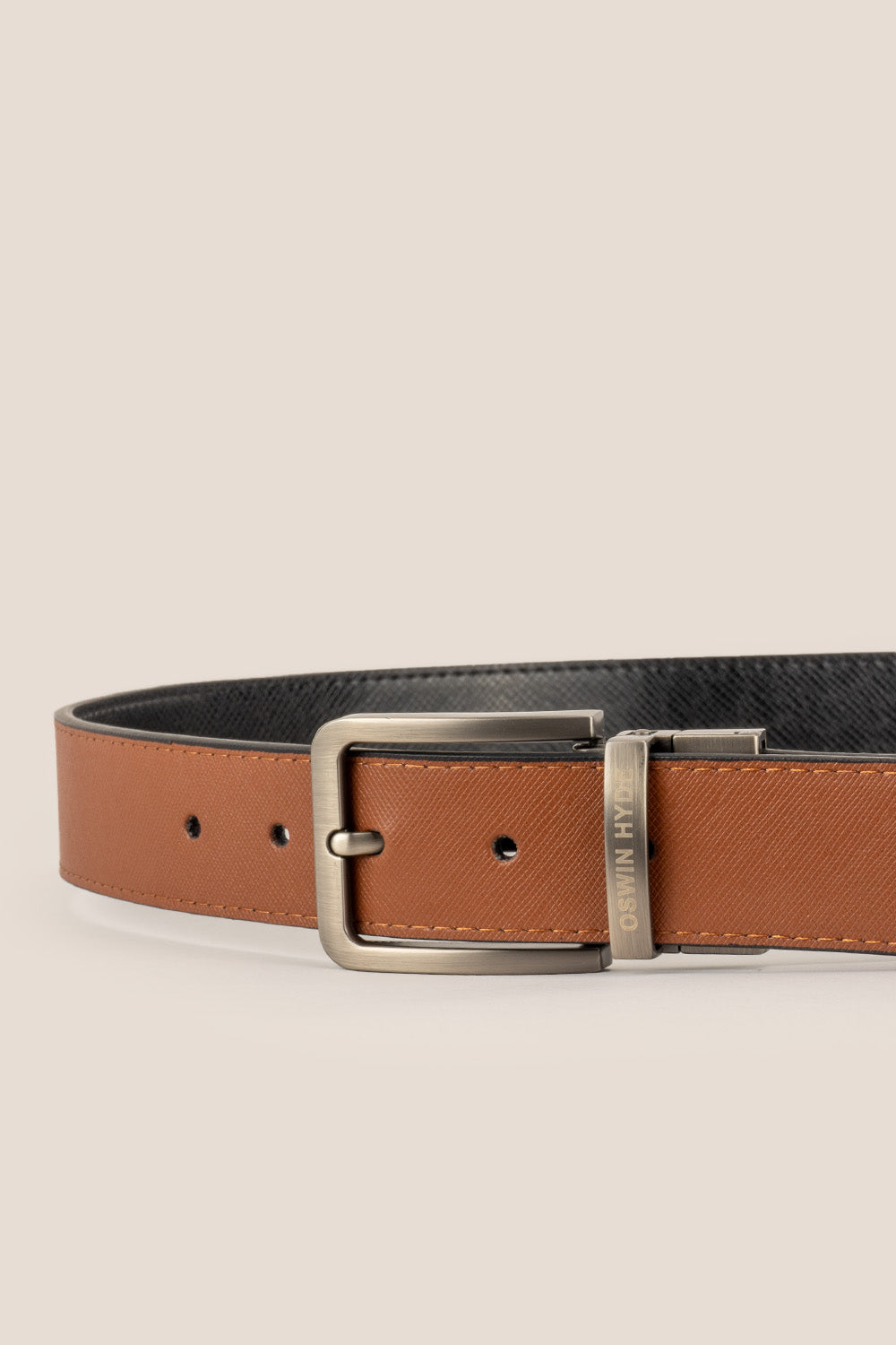 Men’s Claud reversible belt in black and navy premium leather with a sleek polished buckle, designed for versatile and sophisticated styling.