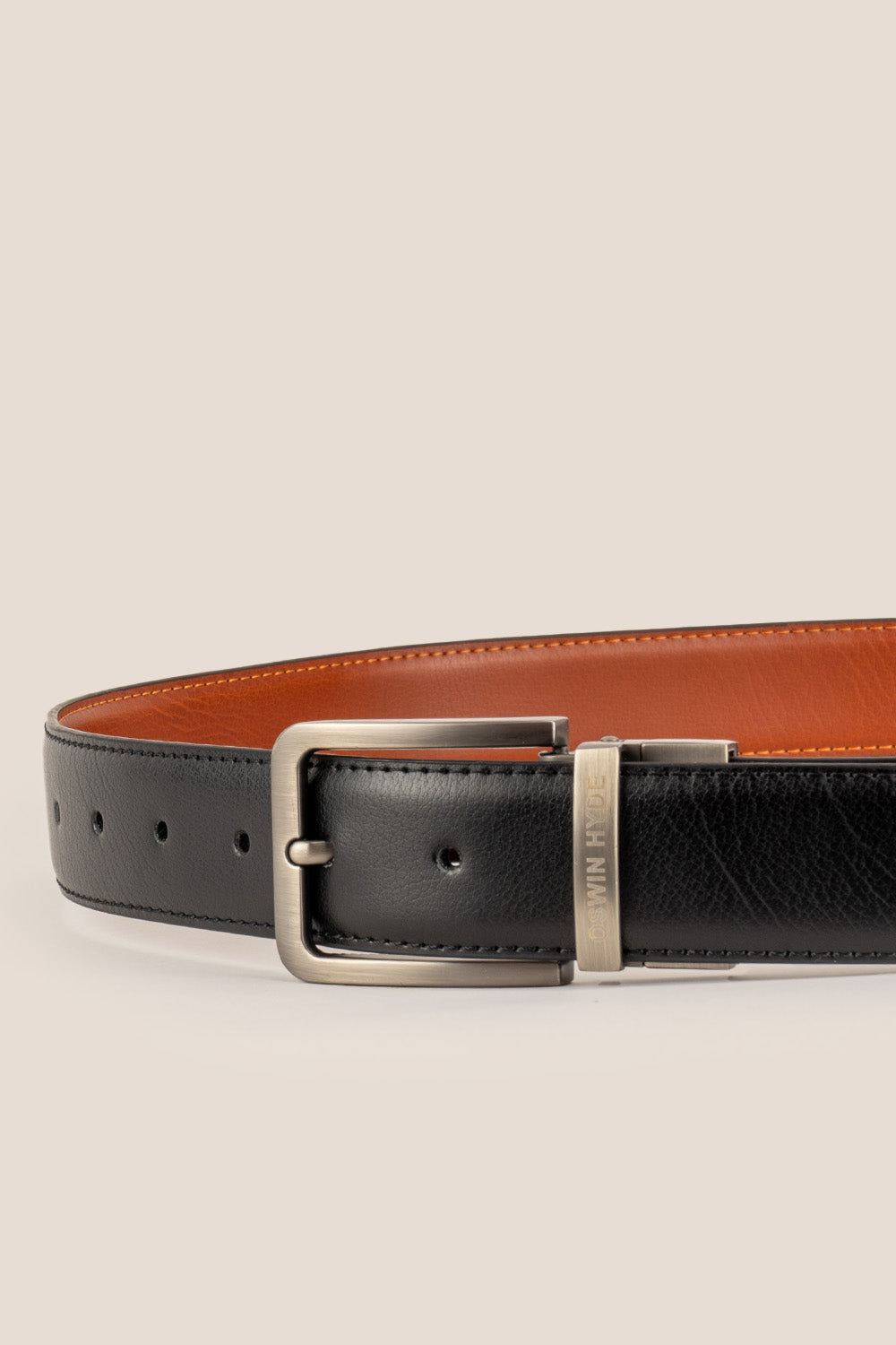 Men’s Claud black and brown reversible leather belt with polished buckle, crafted from premium leather for versatile, elegant wear.