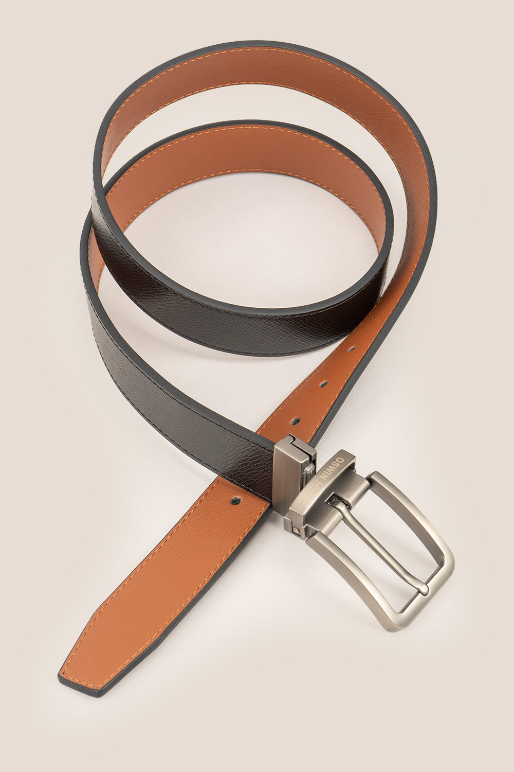 Men’s Claud reversible belt in black and navy premium leather with a sleek polished buckle, designed for versatile and sophisticated styling.
