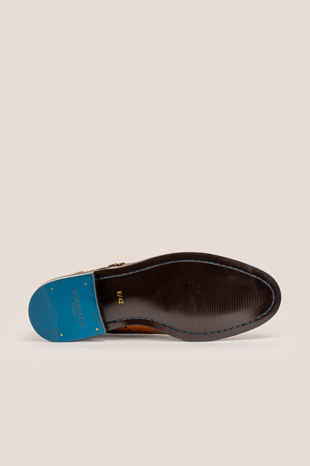 Crafted in rich tan leather, the Warren Monk Strap Brogue blends classic broguing with modern monk straps—ideal for men seeking stylish, versatile formal shoes.