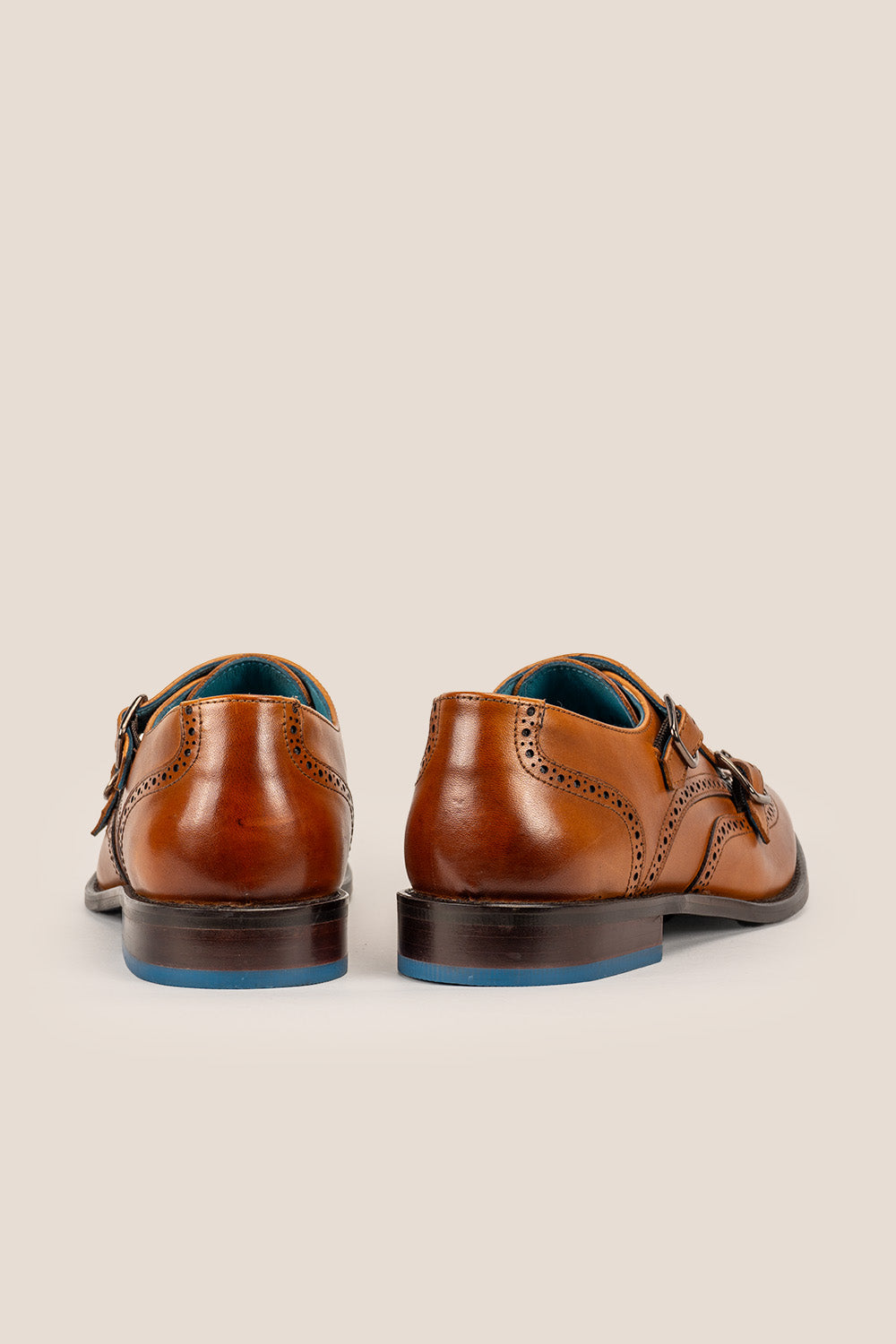 Crafted in rich tan leather, the Warren Monk Strap Brogue blends classic broguing with modern monk straps—ideal for men seeking stylish, versatile formal shoes.