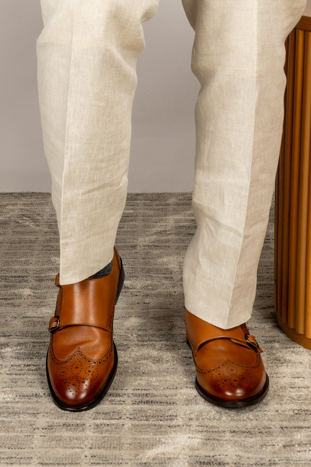 Crafted in rich tan leather, the Warren Monk Strap Brogue blends classic broguing with modern monk straps—ideal for men seeking stylish, versatile formal shoes.
