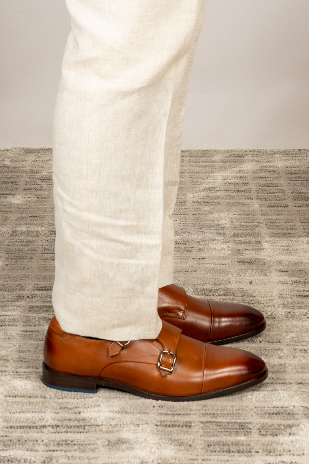 Hadley tan monk strap leather men’s shoes with single buckle design, crafted in high-quality leather and finished with a sleek leather sole.