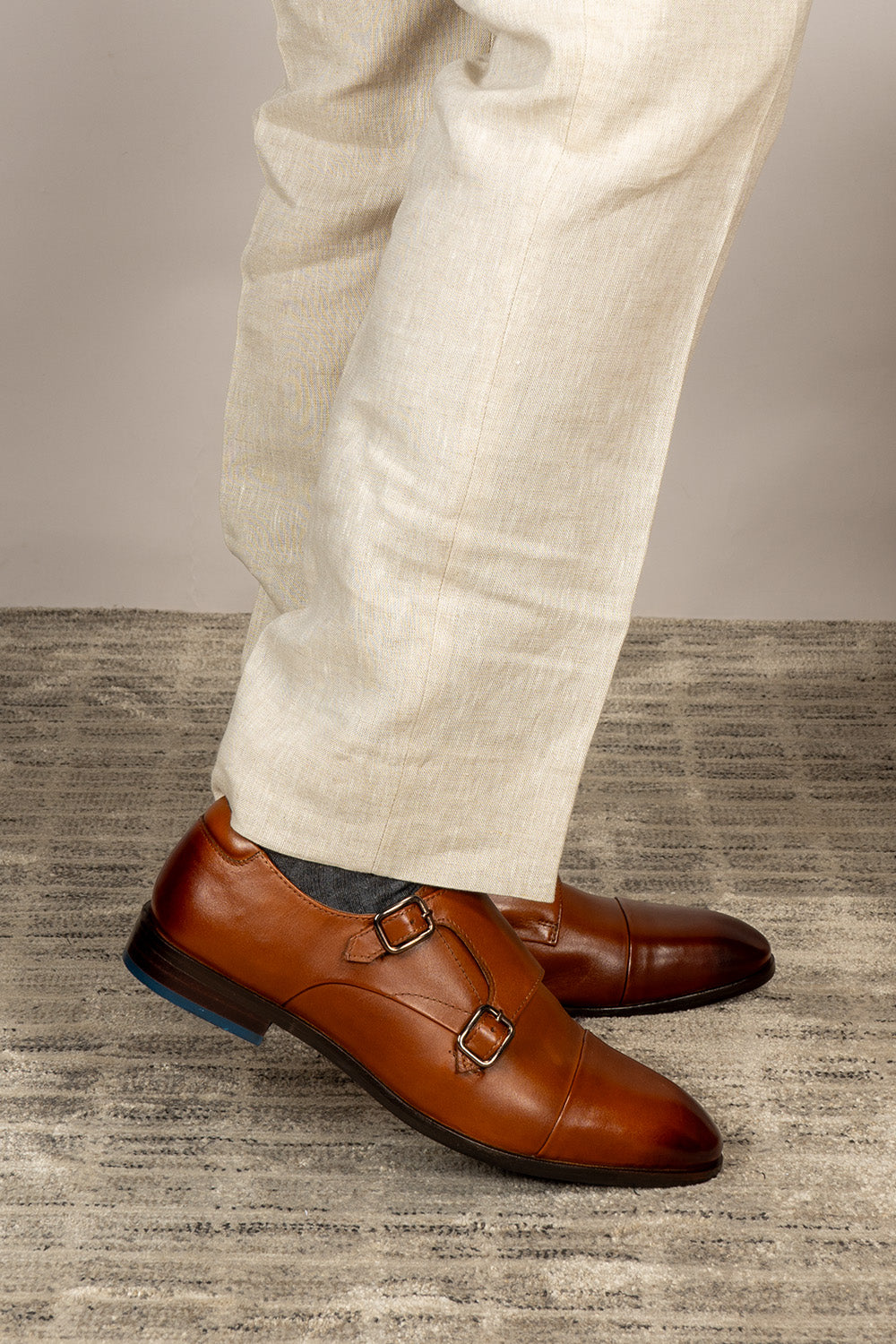 Hadley tan monk strap leather men’s shoes with single buckle design, crafted in high-quality leather and finished with a sleek leather sole.