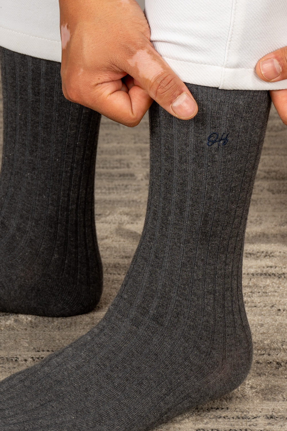 Oswin Hyde Mono three pairs of luxurious cotton socks for men in black, light grey, and dark grey.