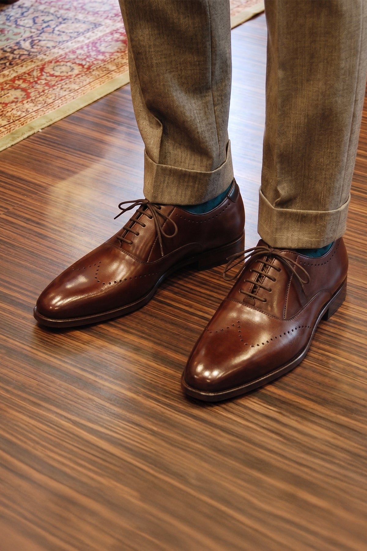 Model wearing Dean Brown men’s Oxford leather shoes in rich brown, crafted with premium leather for formal and smart casual occasions.