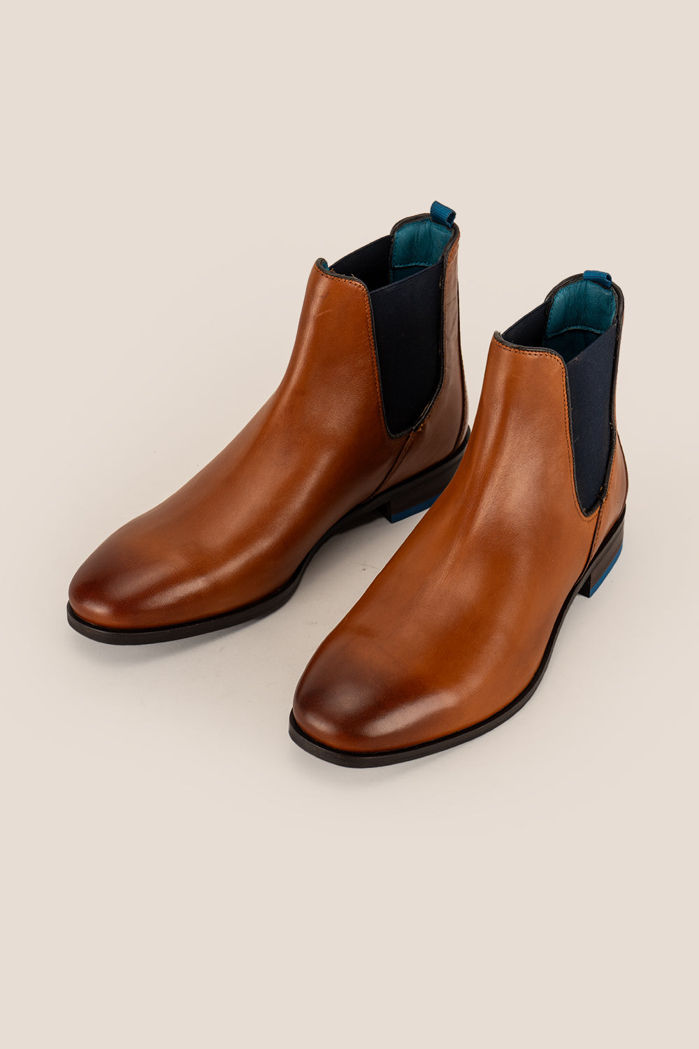 Tan leather Chelsea boots for men by Oswin Hyde – premium slip-on boots with elastic side panels, sleek silhouette, and refined modern style.