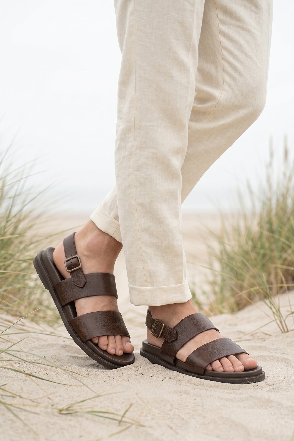 Antonio Brown double strap leather sandals in dark brown worn by a male model, showcasing premium genuine leather and a luxurious design, suitable for stylish men's footwear.