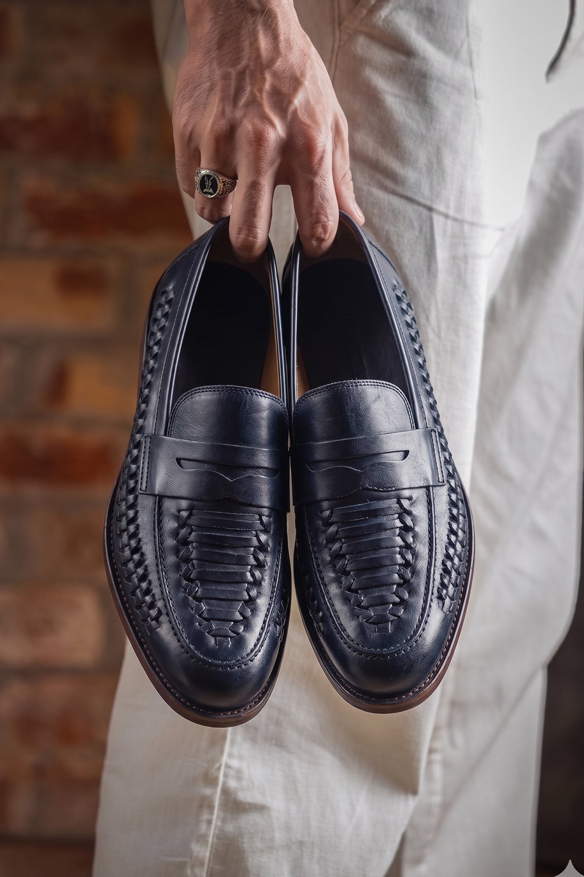 Finley navy woven leather loafers for men, featuring premium craftsmanship, intricate weave detail, and a refined, durable finish