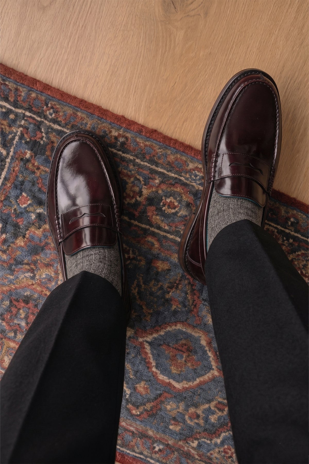 Model wearing Peter Bordo leather penny loafers for men. Classic and stylish, these loafers provide comfort, durability, and a refined look for any occasion.